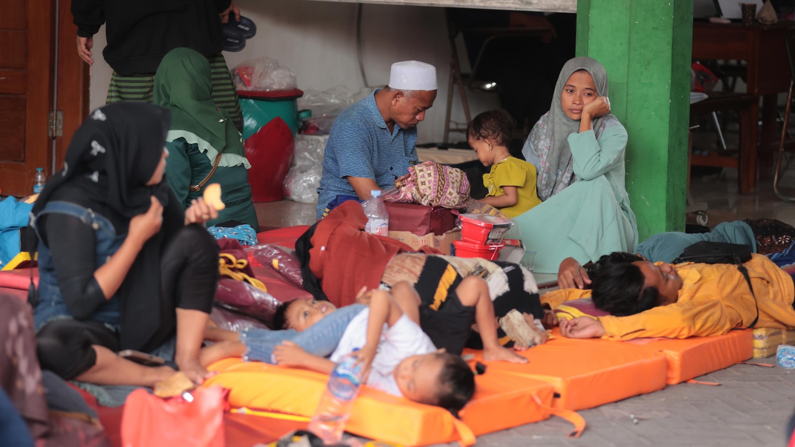 Rescuers run oxygen to survivors in Indonesia school building collapse that buried dozens