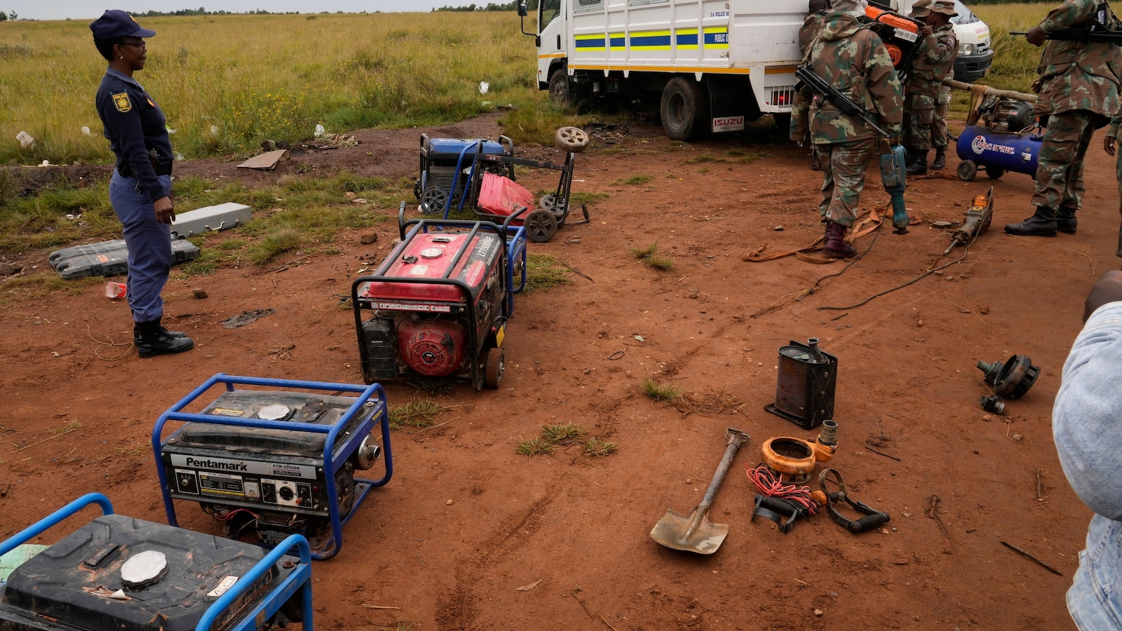 South African soldiers dismantle illegal mining operations near Johannesburg as miners flee