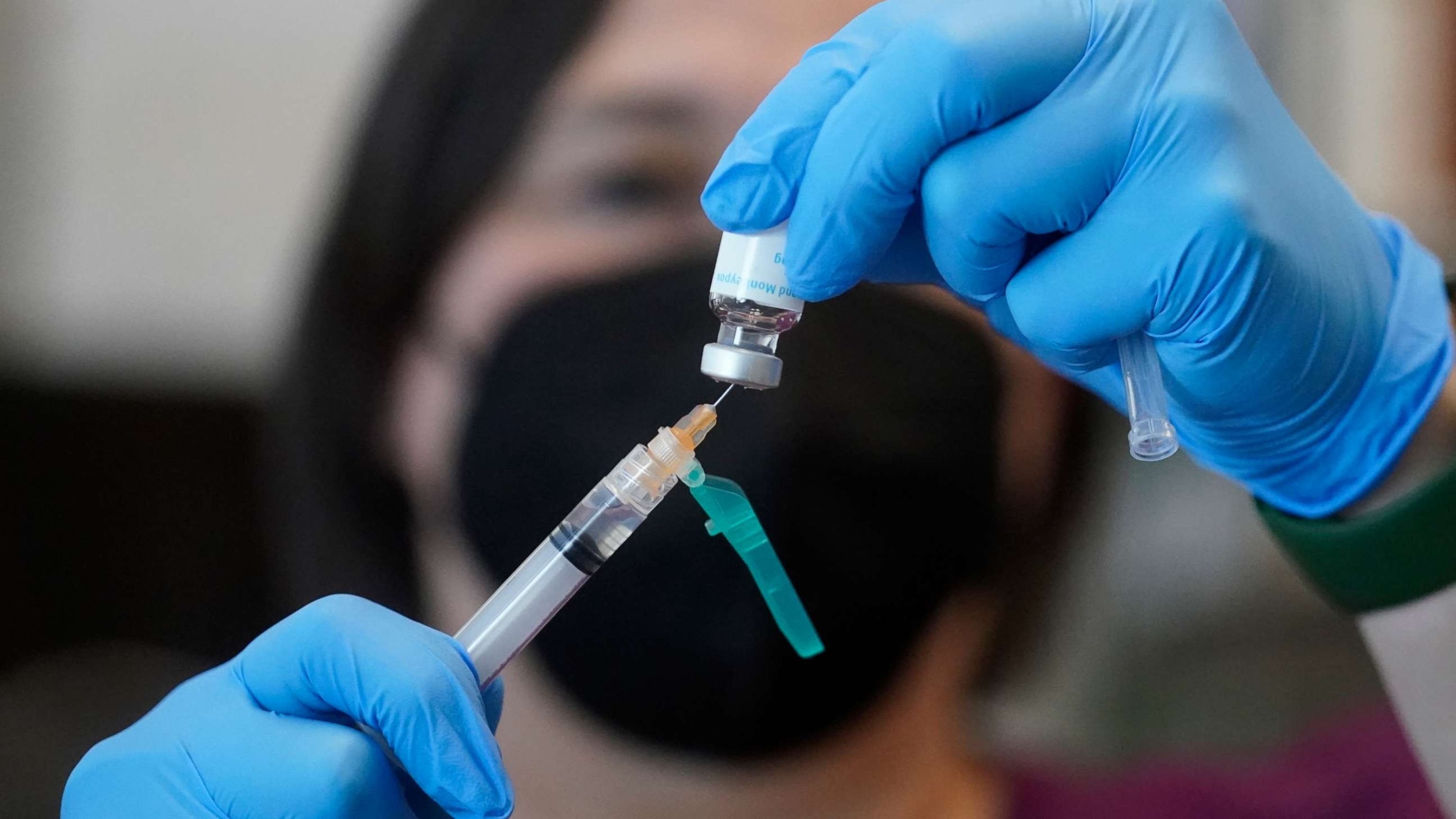 PHOTO: A registered nurse prepares a dose of a monkeypox vaccine at the Salt Lake County Health Department Thursday, July 28, 2022, in Salt Lake City.