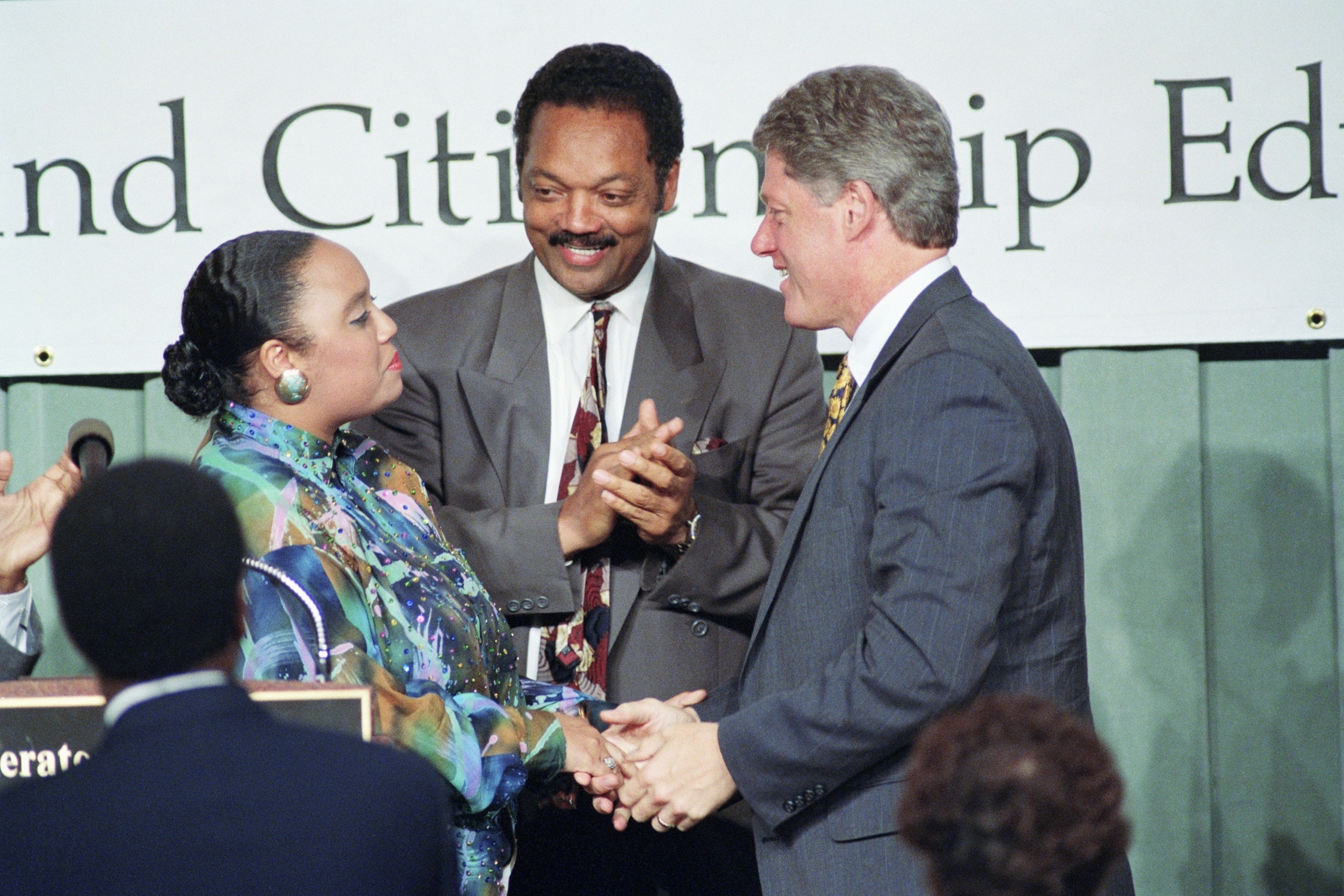 PHOTO: Bill Clinton, right, greets Santita Jackson, daughter of Jesse Jackson, center, following a song performed by Ms. Jackson at a "Rebuild America" conference held by the Rainbow Coalition in Washington, June 13, 1992.