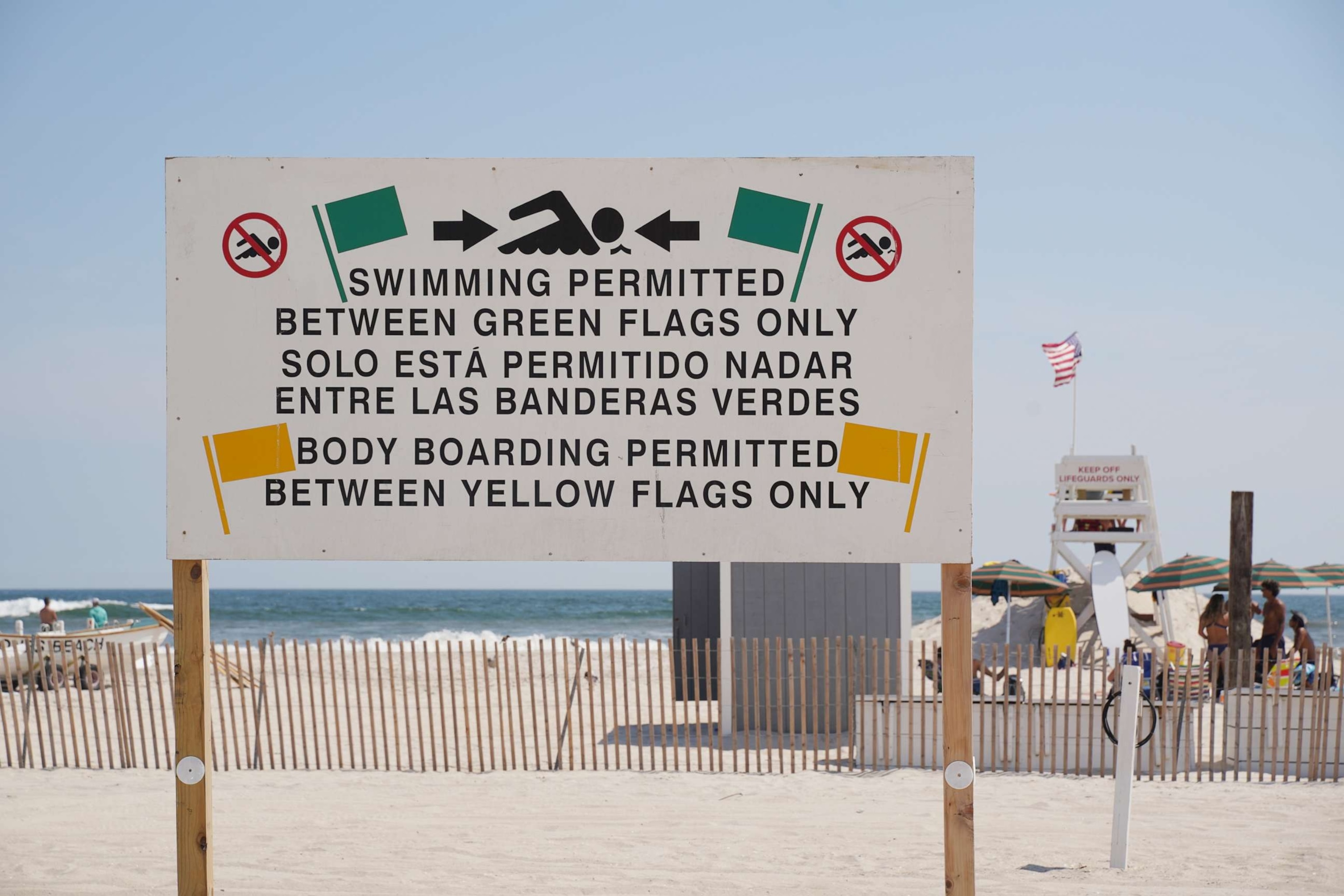 PHOTO: A view of sign as Rockaway Beach temporarily closed for swimming Saturday due to shark sightings in the area in New York, July 22, 2022.