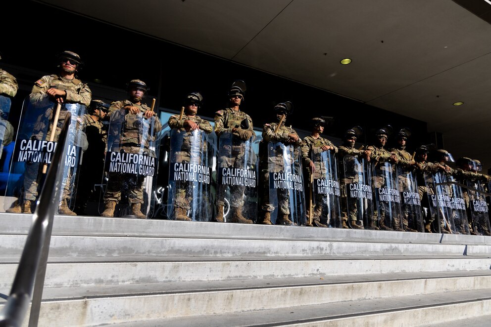 PHOTO: Members of the California National Guard stand guard outside the Federal Building before a curfew takes effect in Los Angeles, June 10, 2025.
