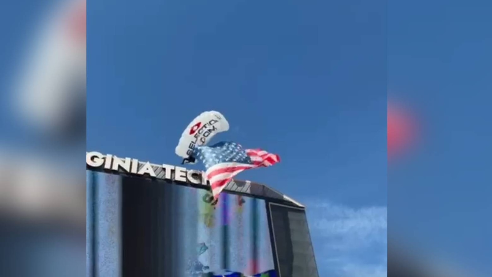 Skydiver slams into Virginia Tech scoreboard, dangles by parachute