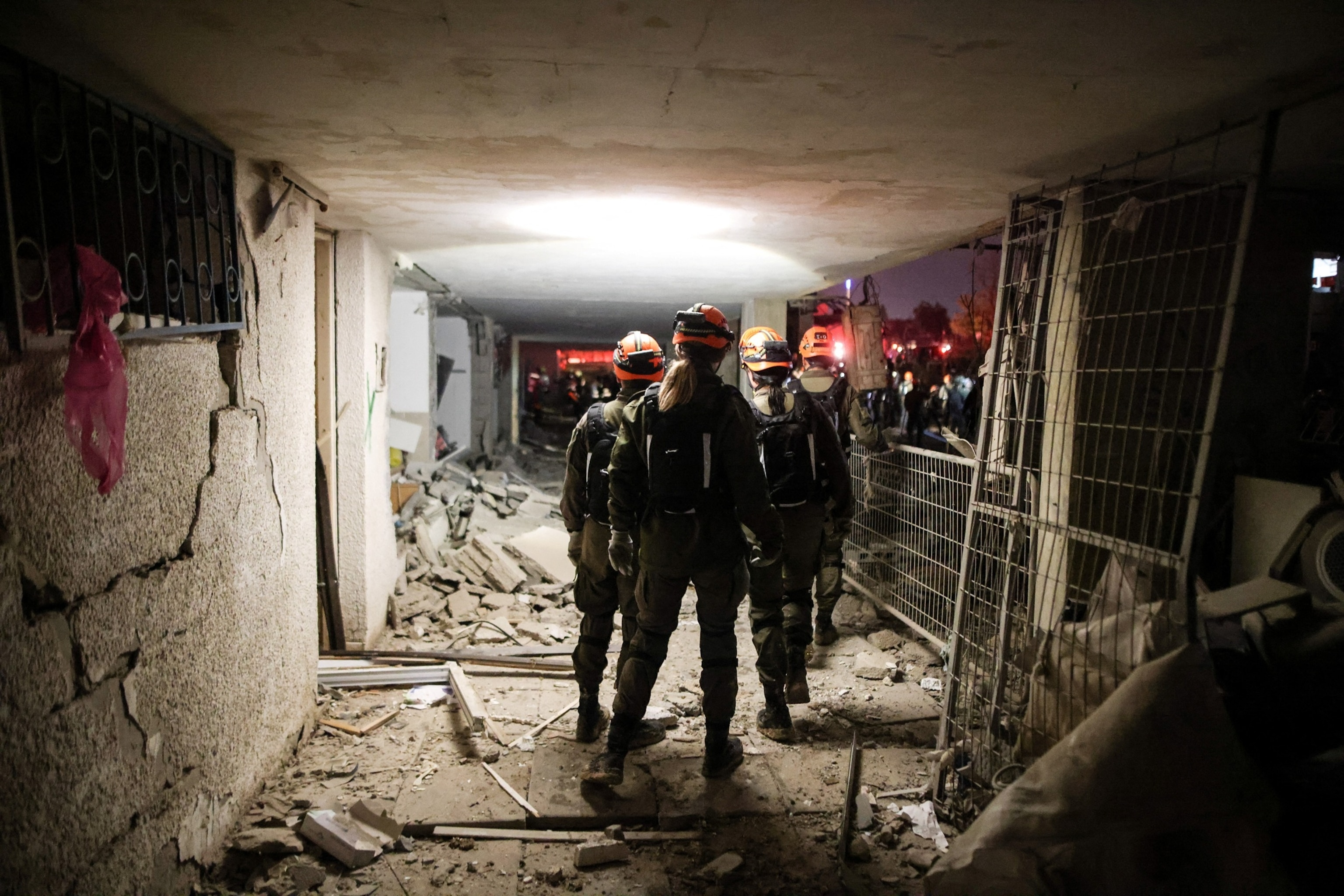 PHOTO: Israeli soldiers work at the scene of damage after Iranian missile barrages struck residential buildings in Arad, amid the U.S.-Israel conflict with Iran, in southern Israel