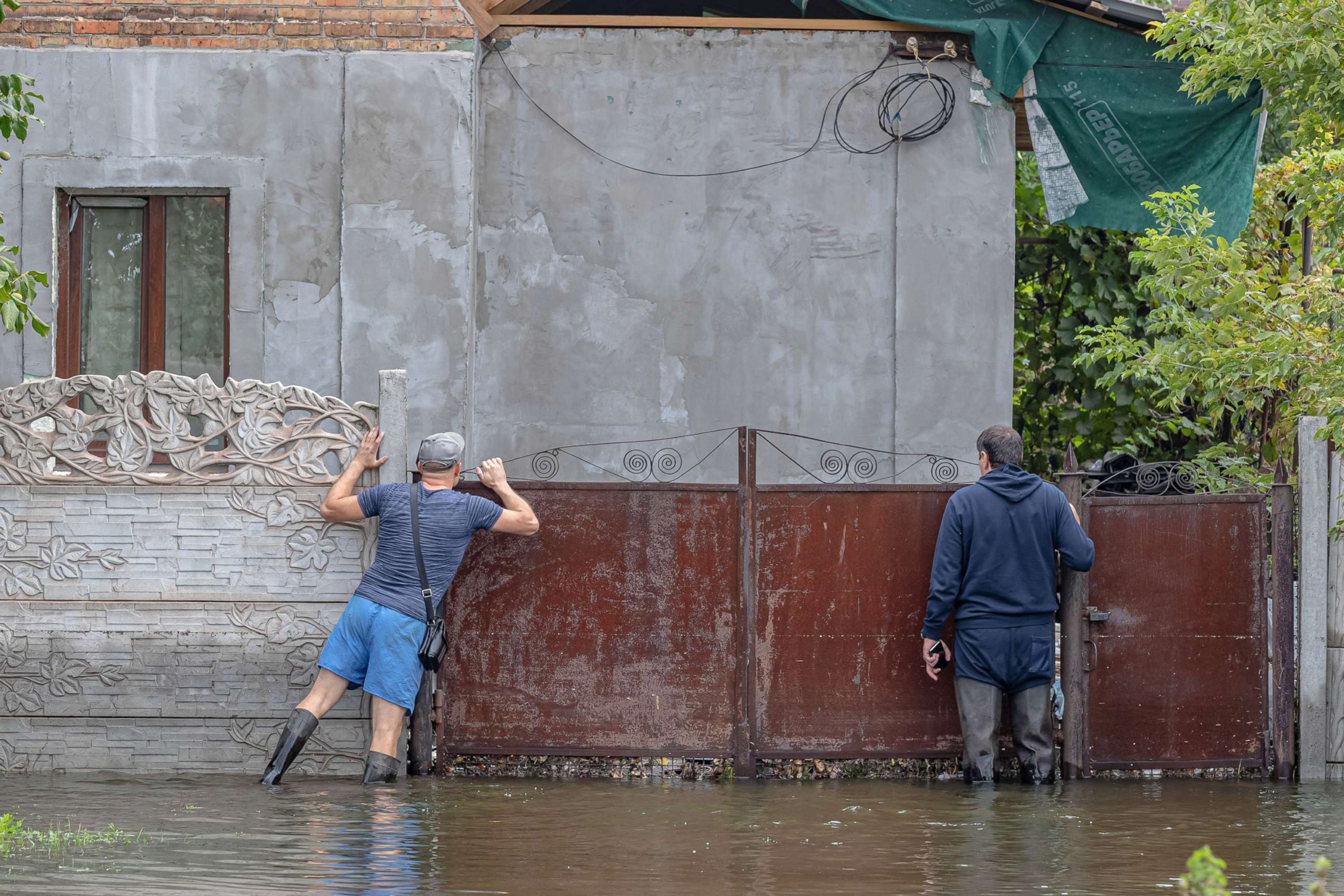 PHOTO: Rescuers adress damages caused by the floods after levels of the Inhulets River rose following a Russian missile strike, in Kryvyi Rih, Ukraine, Sep. 15, 2022.