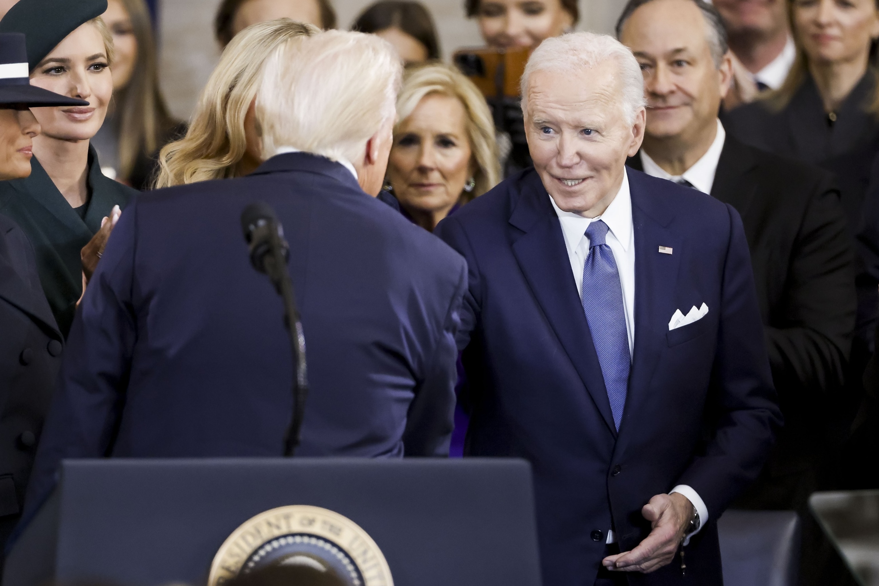 PHOTO: Former US President Joe Biden (R) congratulates President Donald Trump after he was sworn in during an inauguration ceremony in the rotunda of the United States Capitol in Washington, DC, Jan.  20, 2025.