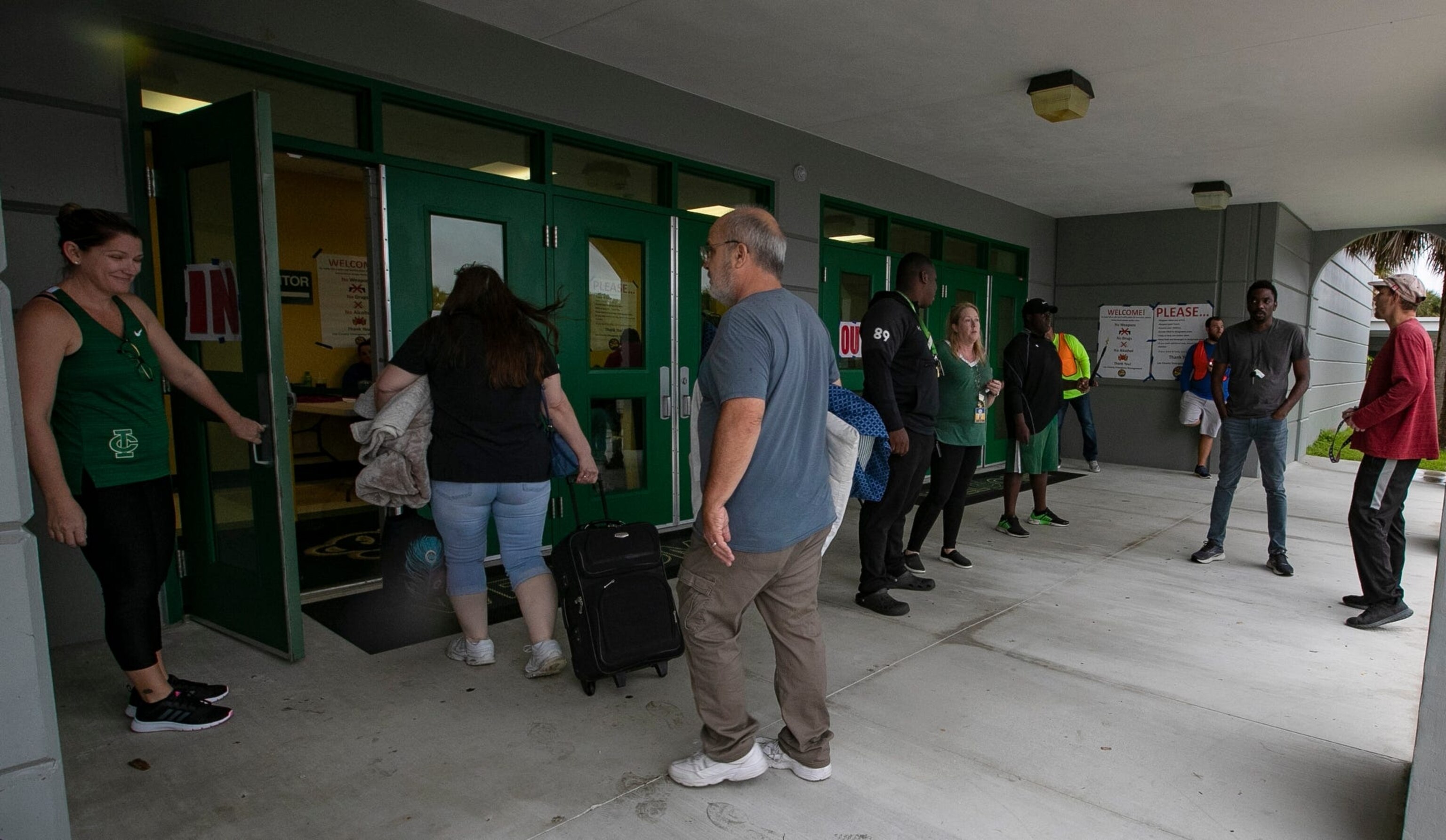 PHOTO: Cape Coral, Florida residents arrive at Island Coast High School, Sept. 27, 2022, after mandatory evacuations in areas of the city were implemented due to possible impact from Hurricane Ian. 