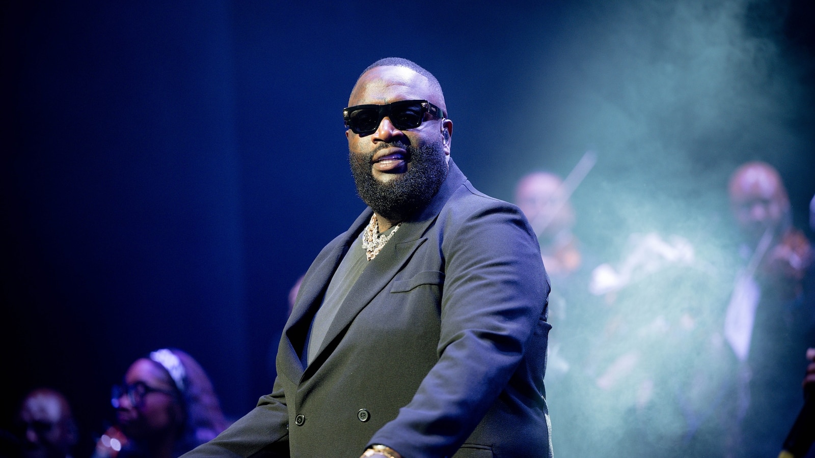Rapper Rick Ross was arrested Thursday on domestic violence charges. The "Hustlin'" rapper is booked in Miami-Dade County jail on two charges of battery, including battery by strangulation. The charges are listed as involving domestic violence. ▻