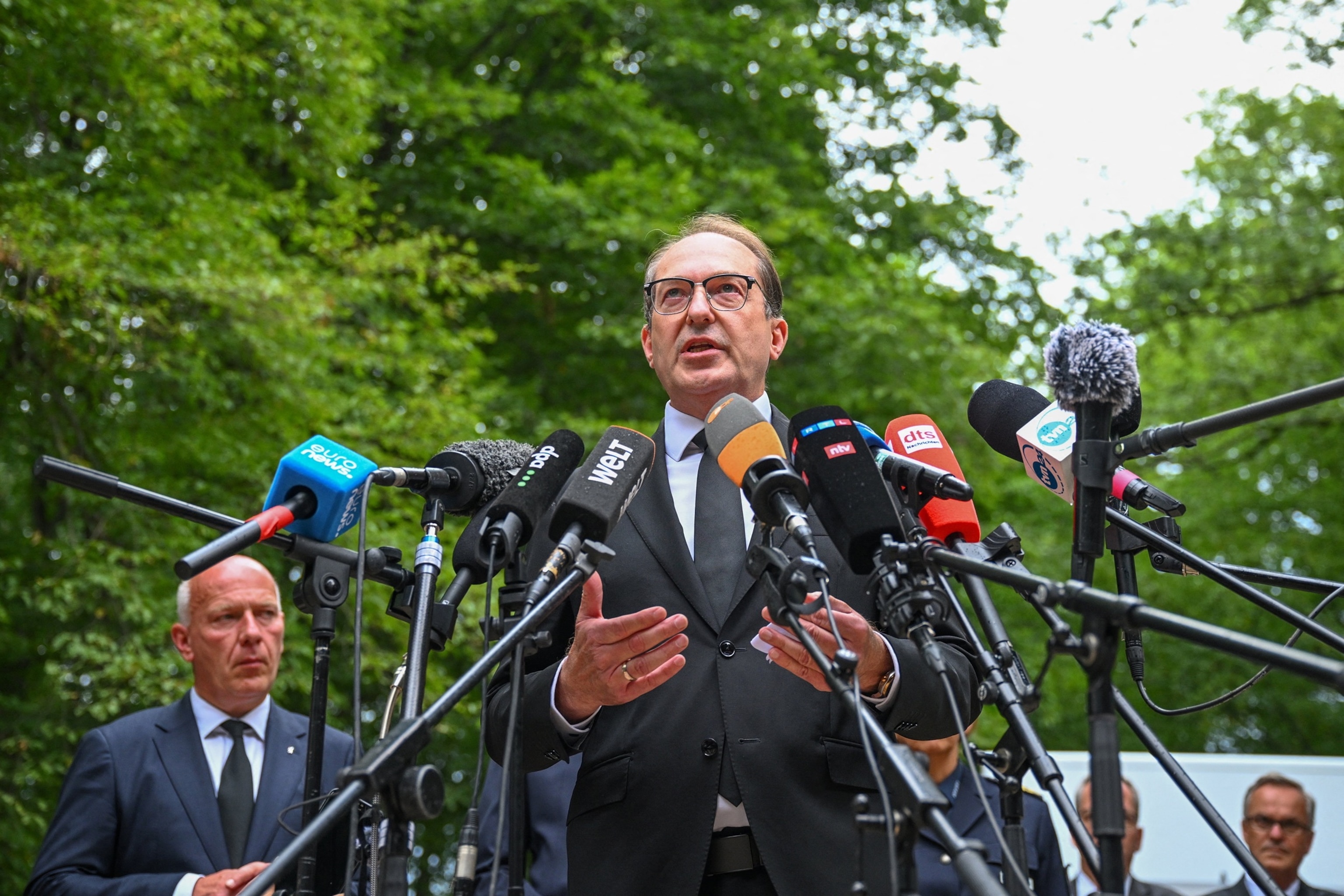 PHOTO: German Interior Minister Alexander Dobrindt speaks to the media, flanked by Berlin mayor Kai Wegner, in Berlin, Germany, July 26, 2026. 
