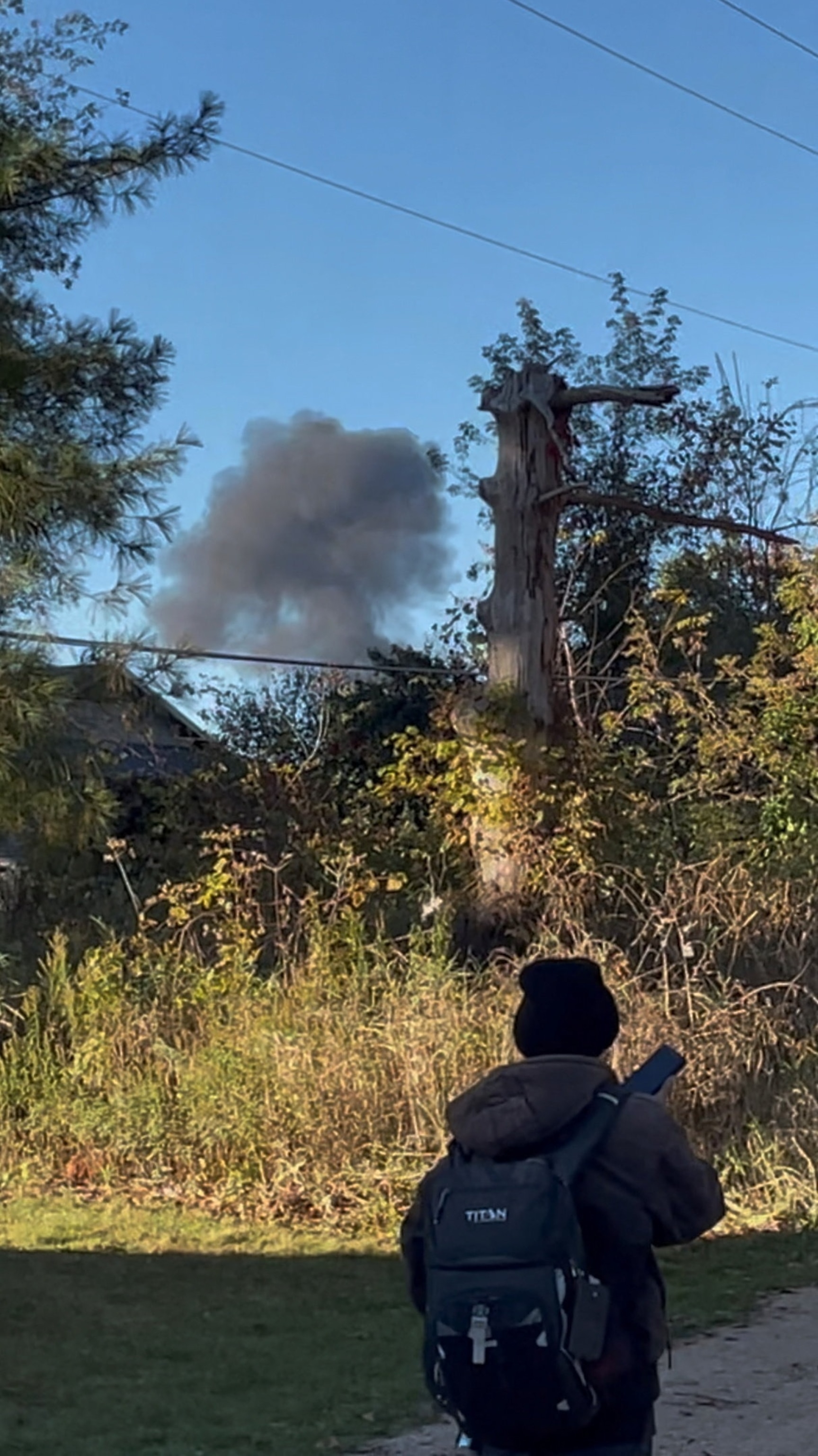 PHOTO: Smoke rises at the site following a deadly aircraft crash in Bath Township