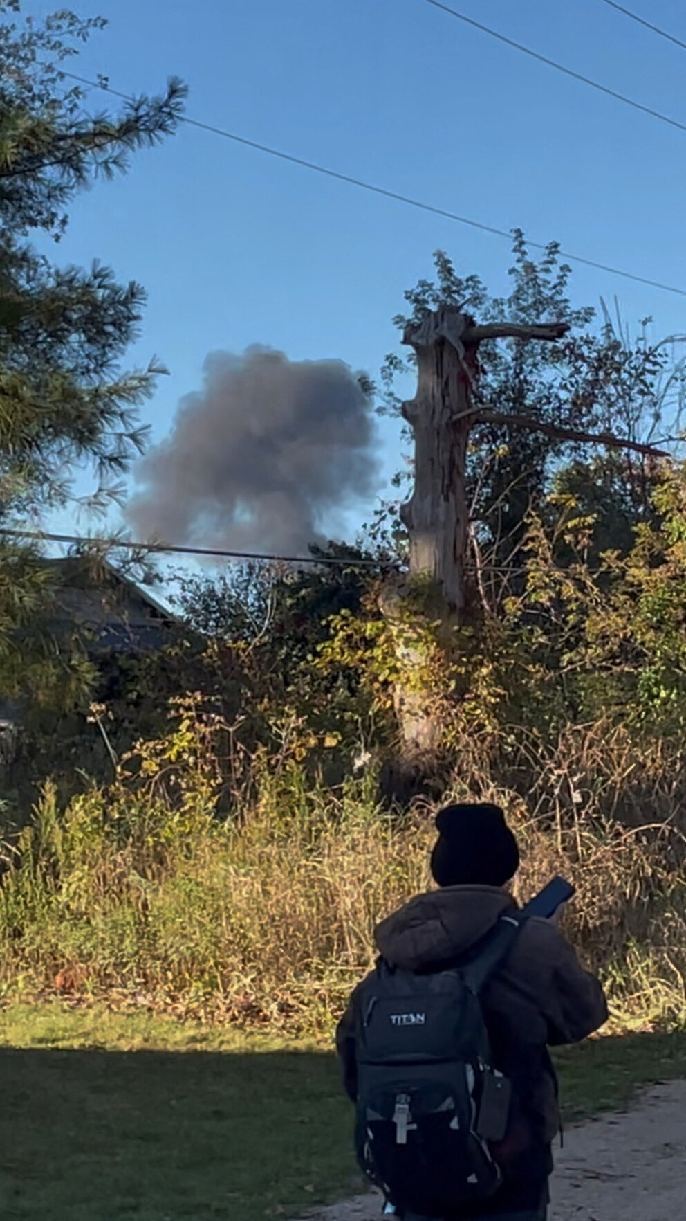PHOTO: Smoke rises at the site following a deadly aircraft crash in Bath Township
