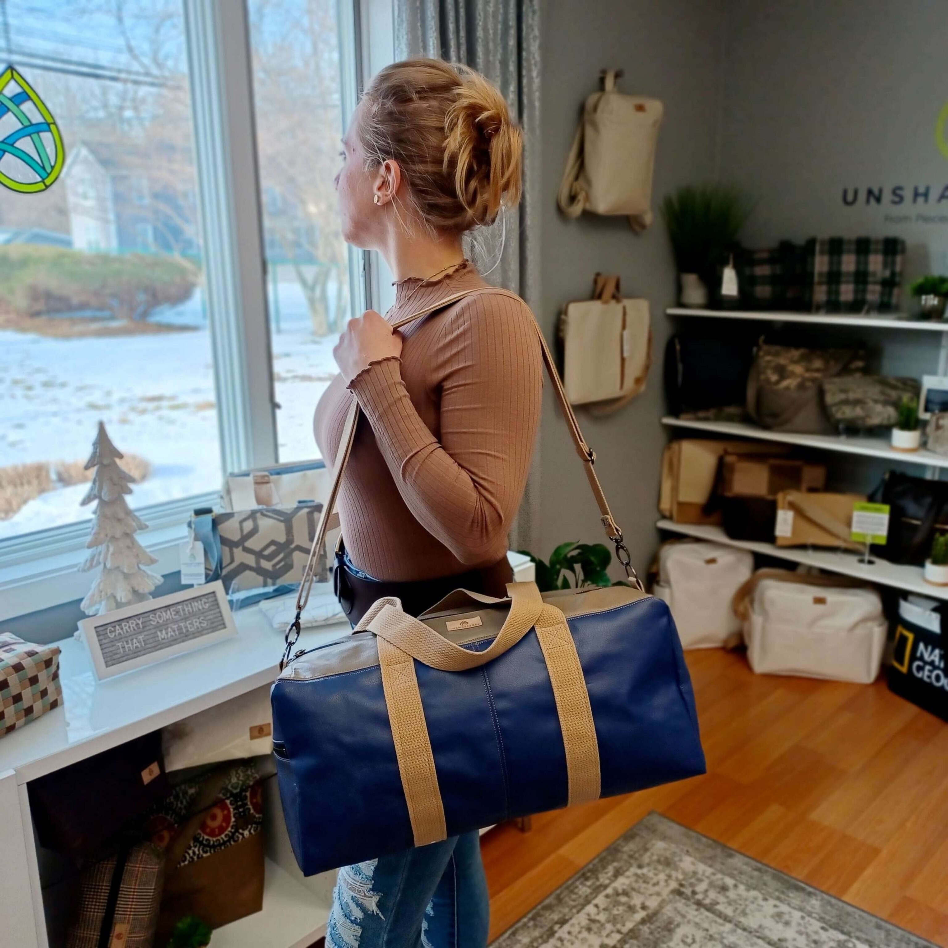 PHOTO: Amanda Richline, one of the team members at Unshattered shows off the latest bag collaboration with Southwest Airlines.