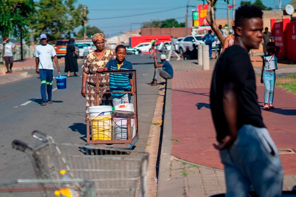 PHOTO: Residents of the township of Soweto, South Africa, queue for water, March 16, 2024. 