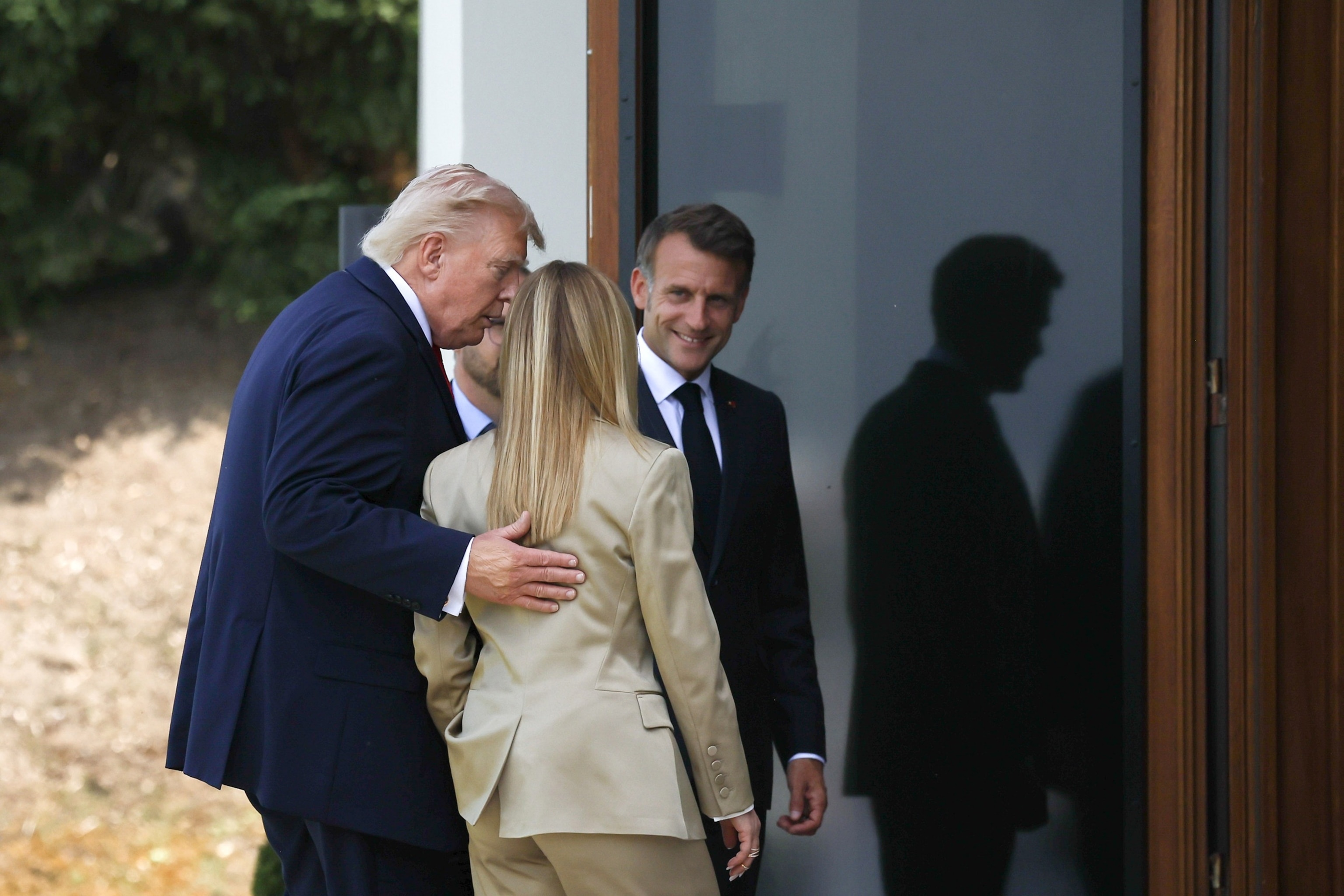 PHOTO: President Donald Trump, Italy's Prime Minister Giorgia Meloni,  and French President Emmanuel Macron are on their way to working session at Hotel Royal during the G7 summit in Evian-les-Bains, France, June 16, 2026.