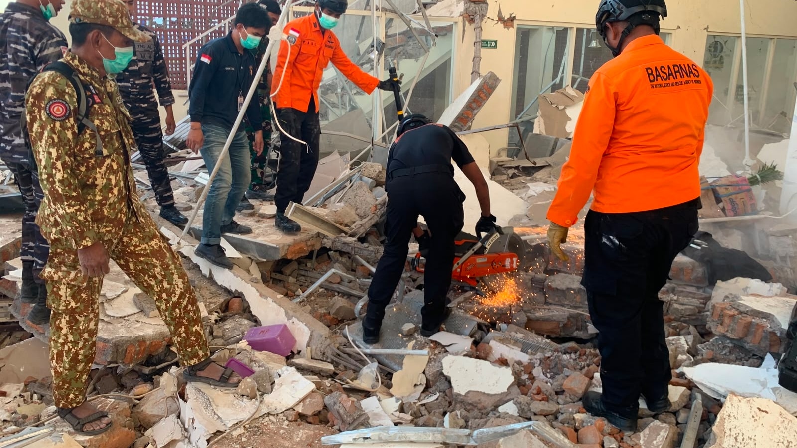 Powerful earthquake strikes off Indonesia, killing at least 20 and toppling buildings