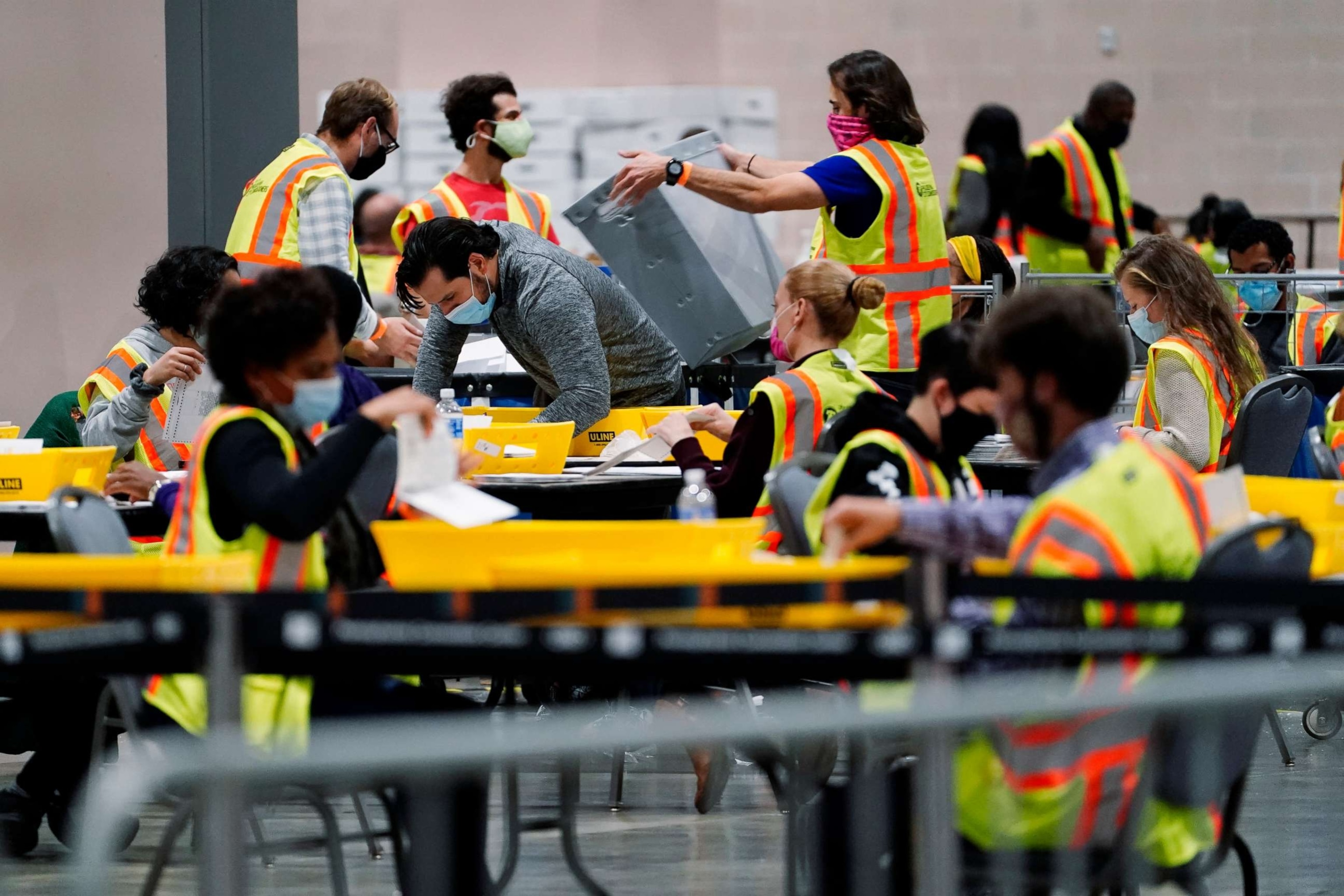 PHOTO: Philadelphia election workers process mail-in and absentee ballots for the general election, at the Pennsylvania Convention Center, Nov. 3, 2020, in Philadelphia.