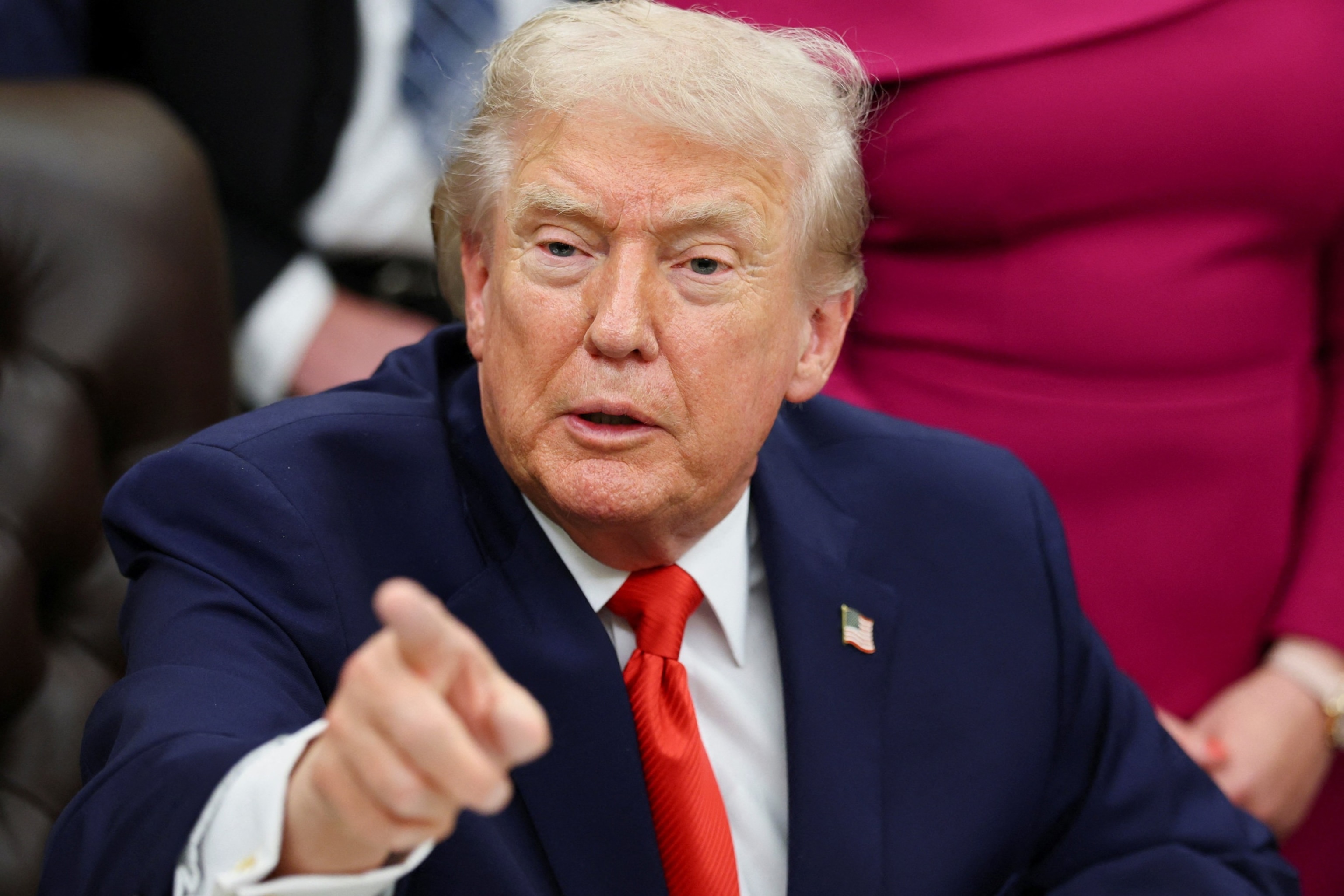 PHOTO: U.S. President Donald Trump signs a bill to award congressional gold medals to members of the 1980 U.S. Olympic men's hockey team, in Washington