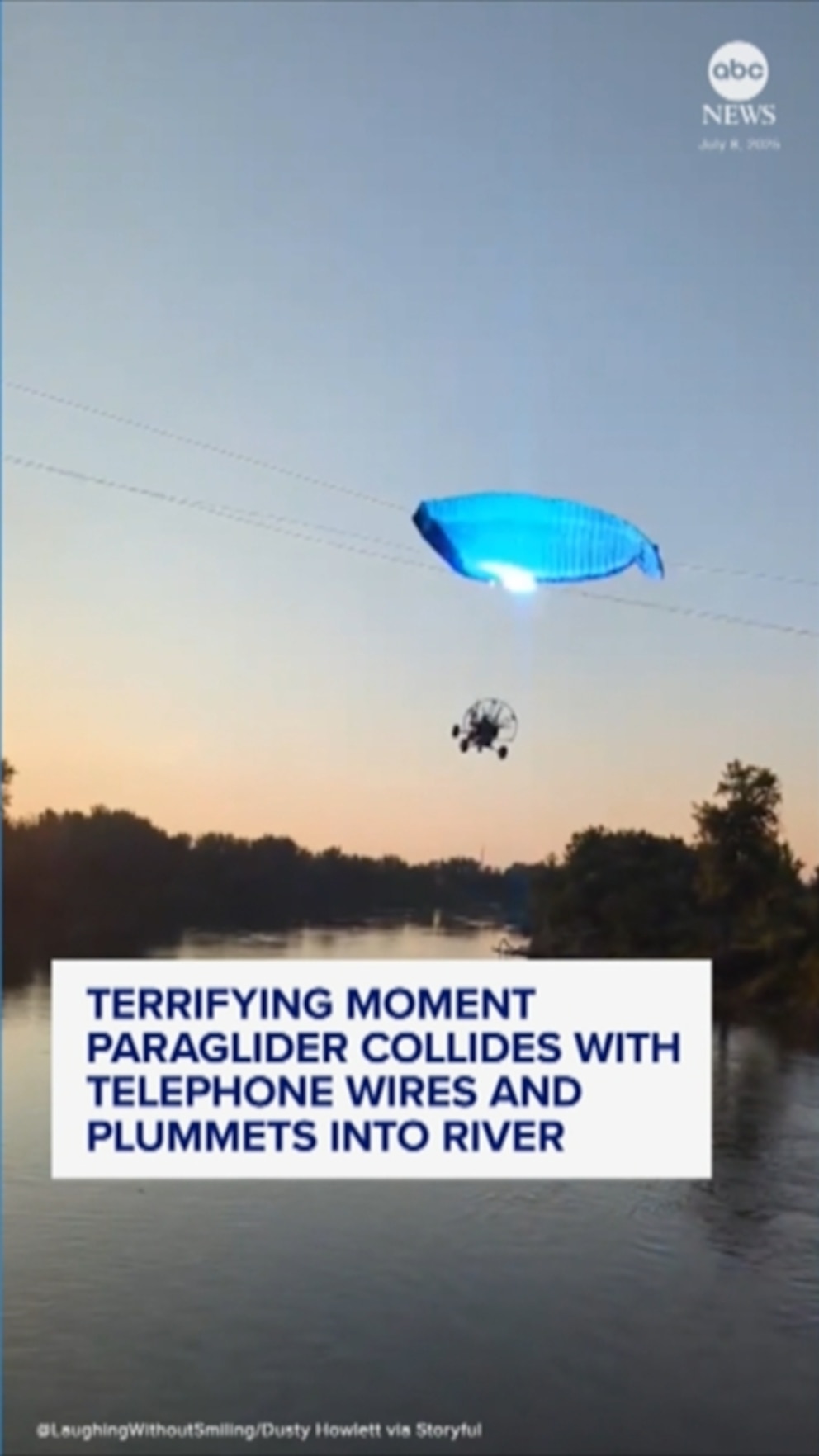 WATCH: Paraglider hits phone lines and plunges into river