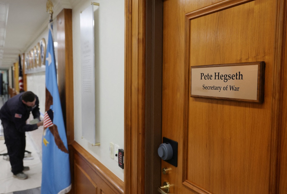 PHOTO: Signage is replaced after Trump ordered return to the US 'War Department', in Washington