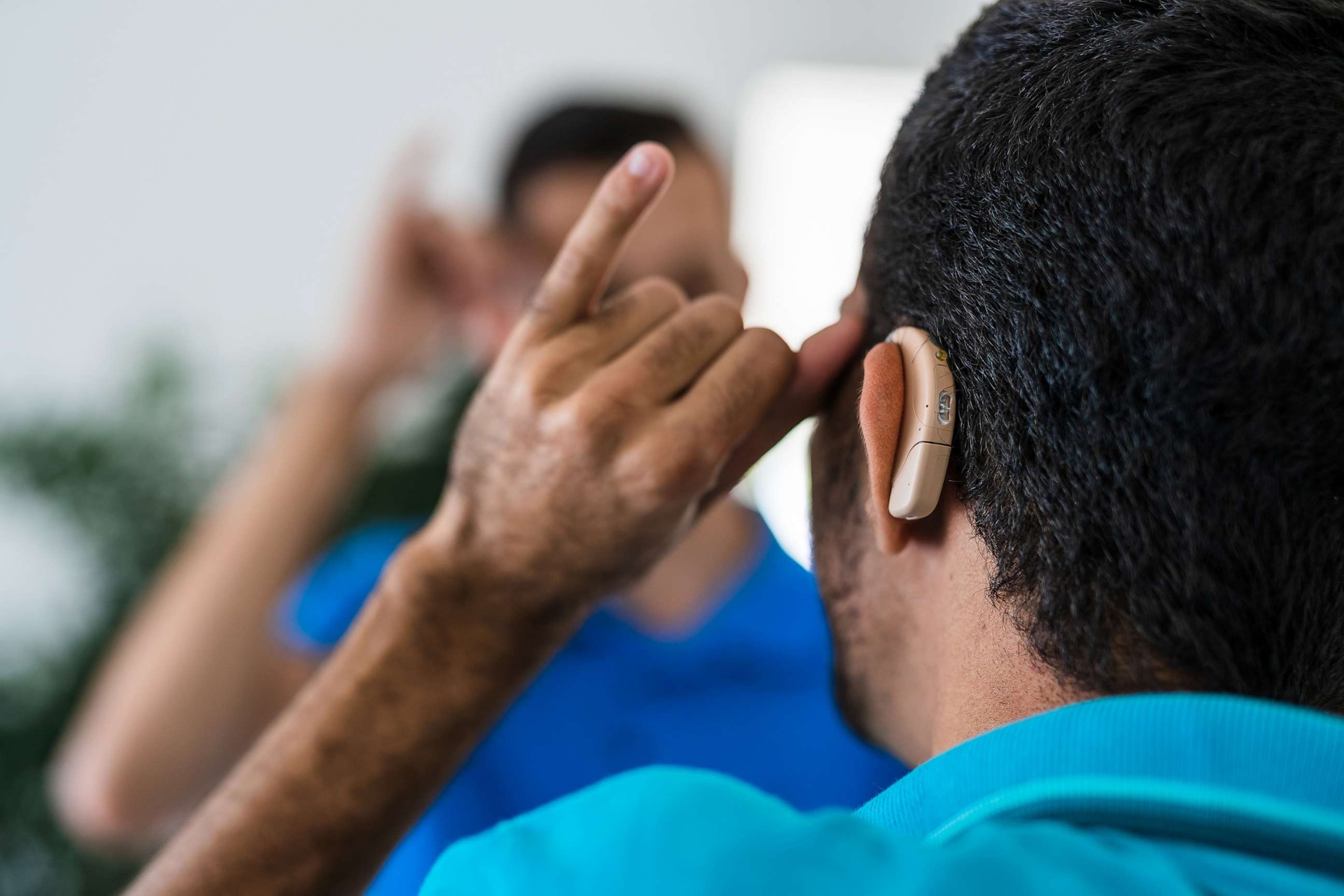 PHOTO: A deaf man with his back turned