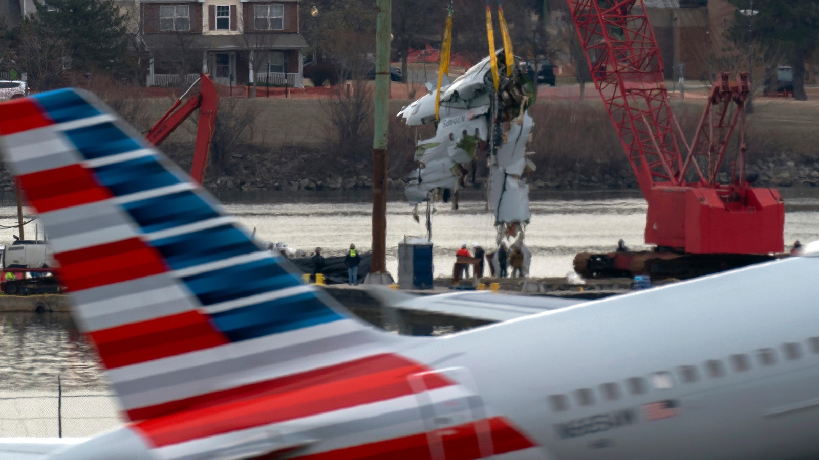 Family of 1 of the 67 Washington plane crash victims sues the FAA, Army and American Airlines