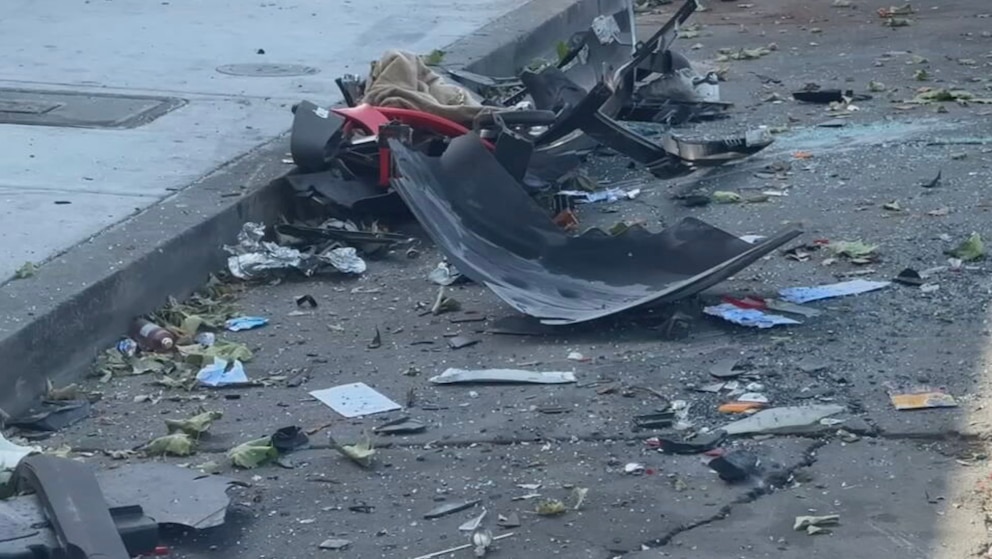 PHOTO: Broken car parts and other debris are scattered at the site where three people were killed, May 17, 2026, in Oakland, Calif., when a vehicle struck pedestrians, according to fire officials, who said the driver and several other people were injured.