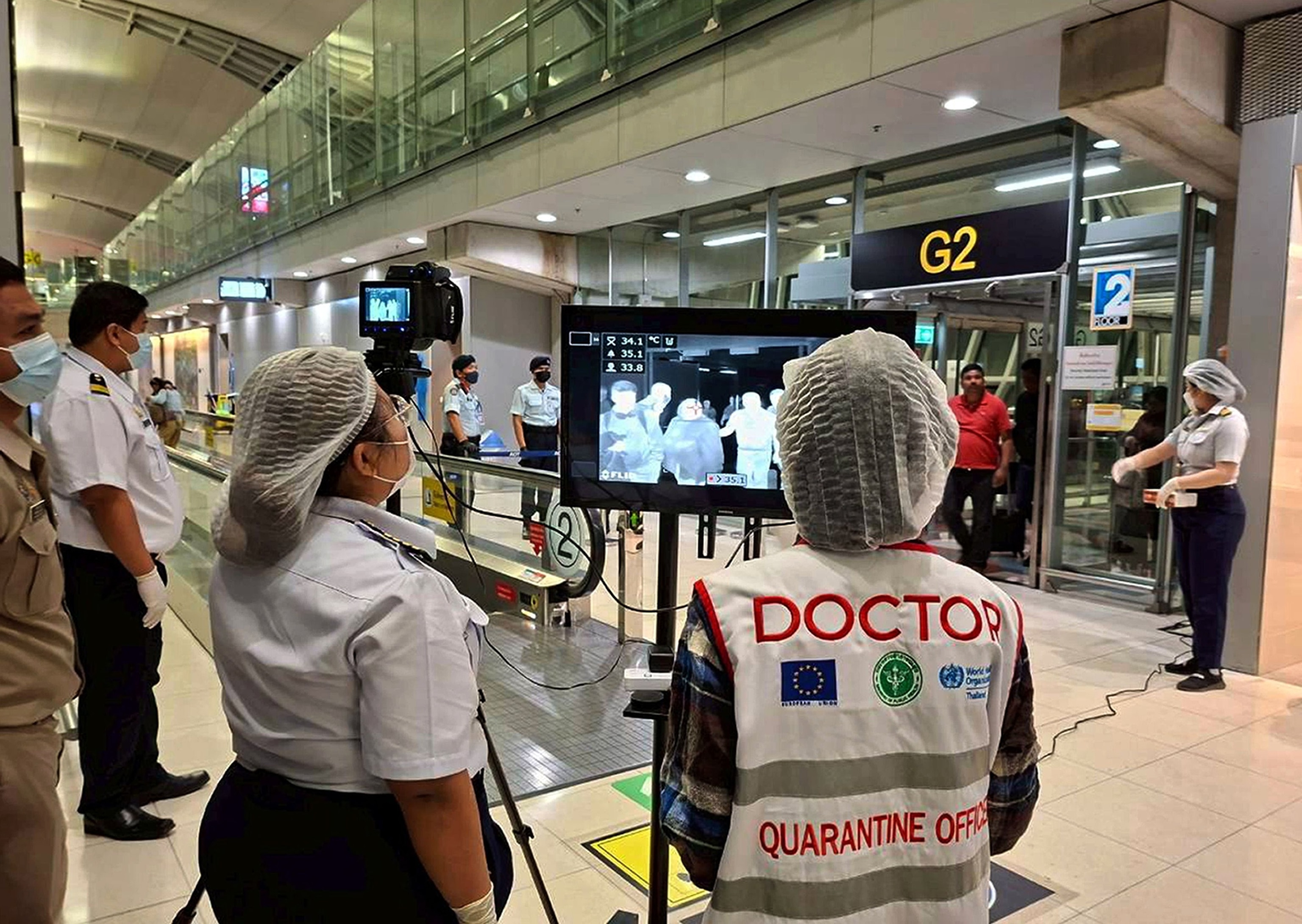 PHOTO: A handout photo released by Suvarnabhumi Airport shows Thai health officials wearing protective masks monitoring passengers from international flights arriving at Suvarnabhumi Airport, Samut Prakan province, Thailand, Jan. 25, 2026. 
