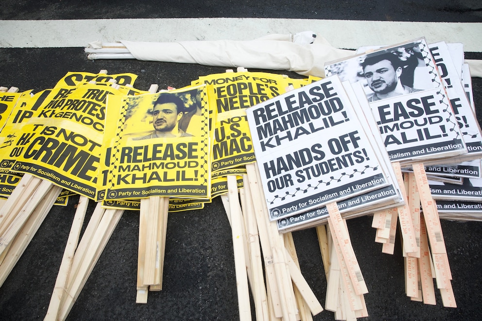 PHOTO: Signs in support of detained graduate student Mahmoud Khalil,  are readied during the nationwide "Hands Off!" protest against President Donald Trump and his advisor, Tesla CEO Elon Musk, in Washington, DC, on April 5, 2025. 