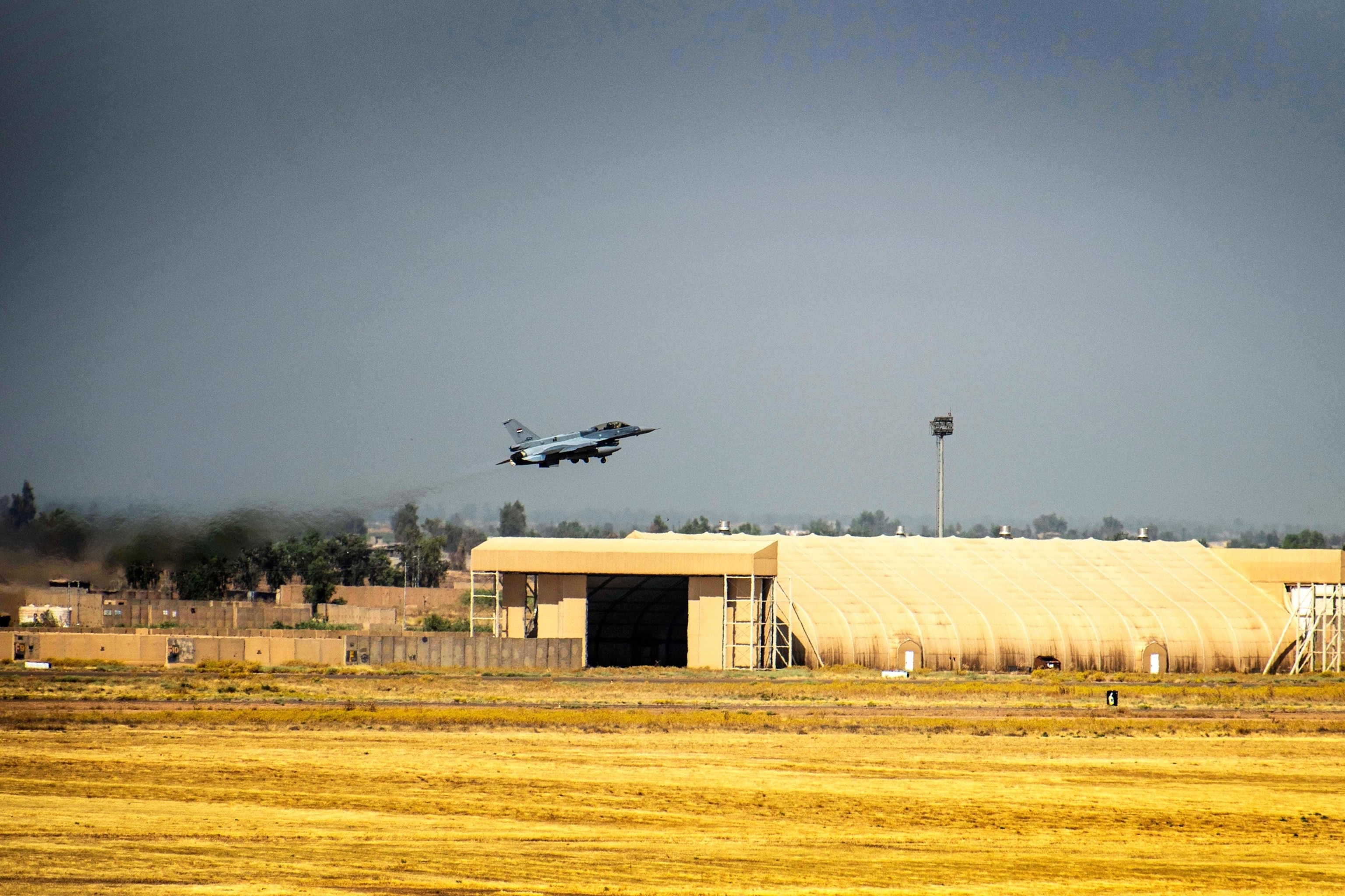 PHOTO: An Iraqi Air Force F-16 Fighting Falcon fighter aircraft takes off the runway at Balad Air Base, Iraq, June 17, 2019. The 9th FS has been learning the Air Tasking Order process from air advisors from the 370th Air Expeditionary Advisory Squadron.