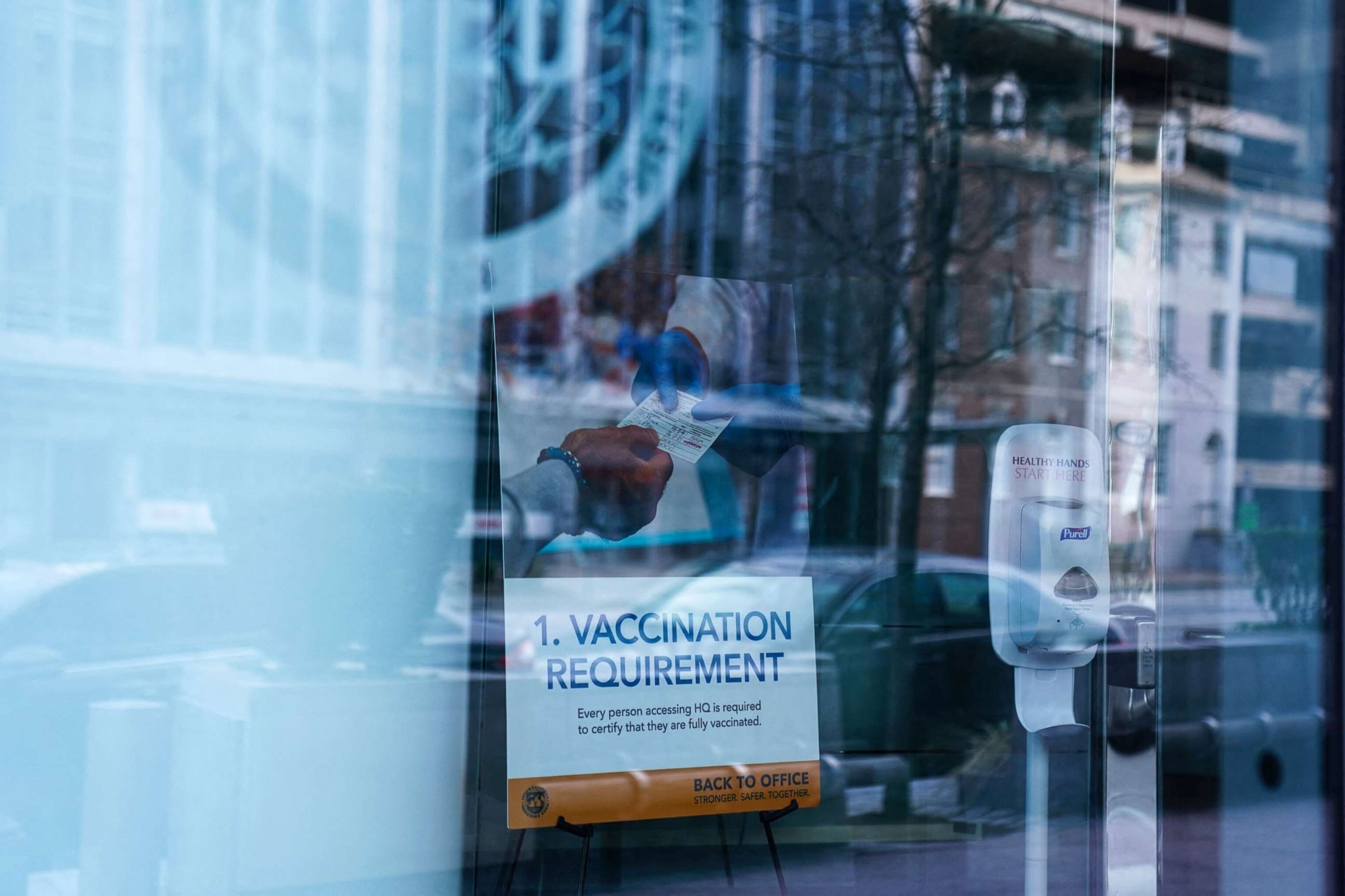 PHOTO: In this Jan. 31, 2022, file photo, a sign requiring proof of a COVID-19 vaccination is displayed inside of an office building in Washington, D.C.