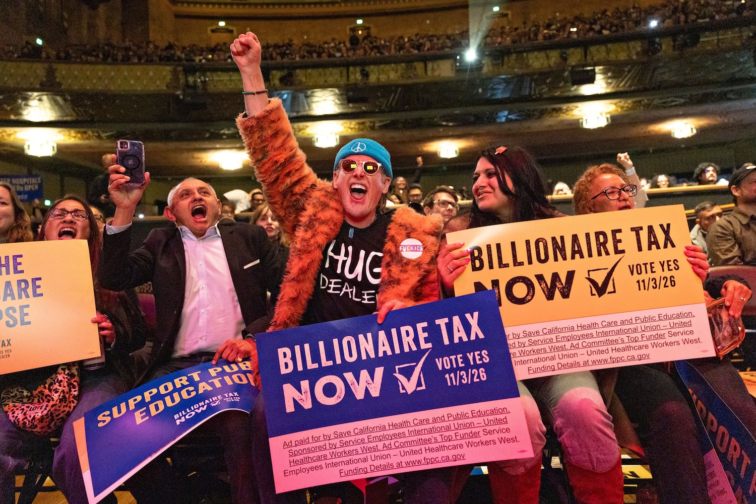 People attend a Billionaire Tax Now rally, Feb. 18, 2026 in Los Angeles Jason Armond/Los Angeles Times via Getty Images