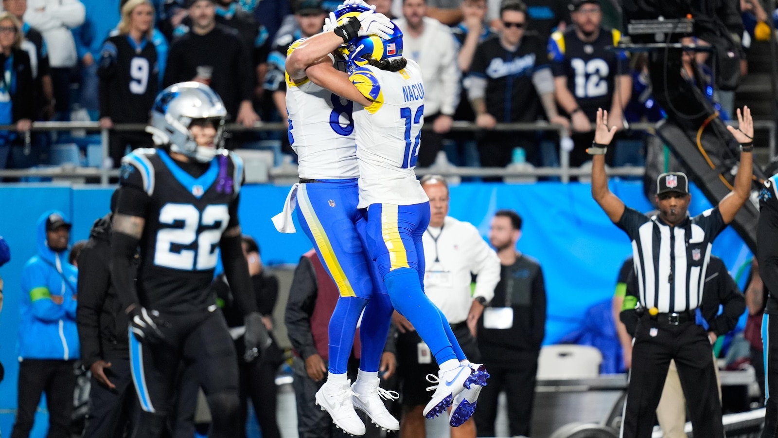 Stafford's late TD pass to Parkinson lifts the Rams past the Panthers 34-31 in the wild-card round