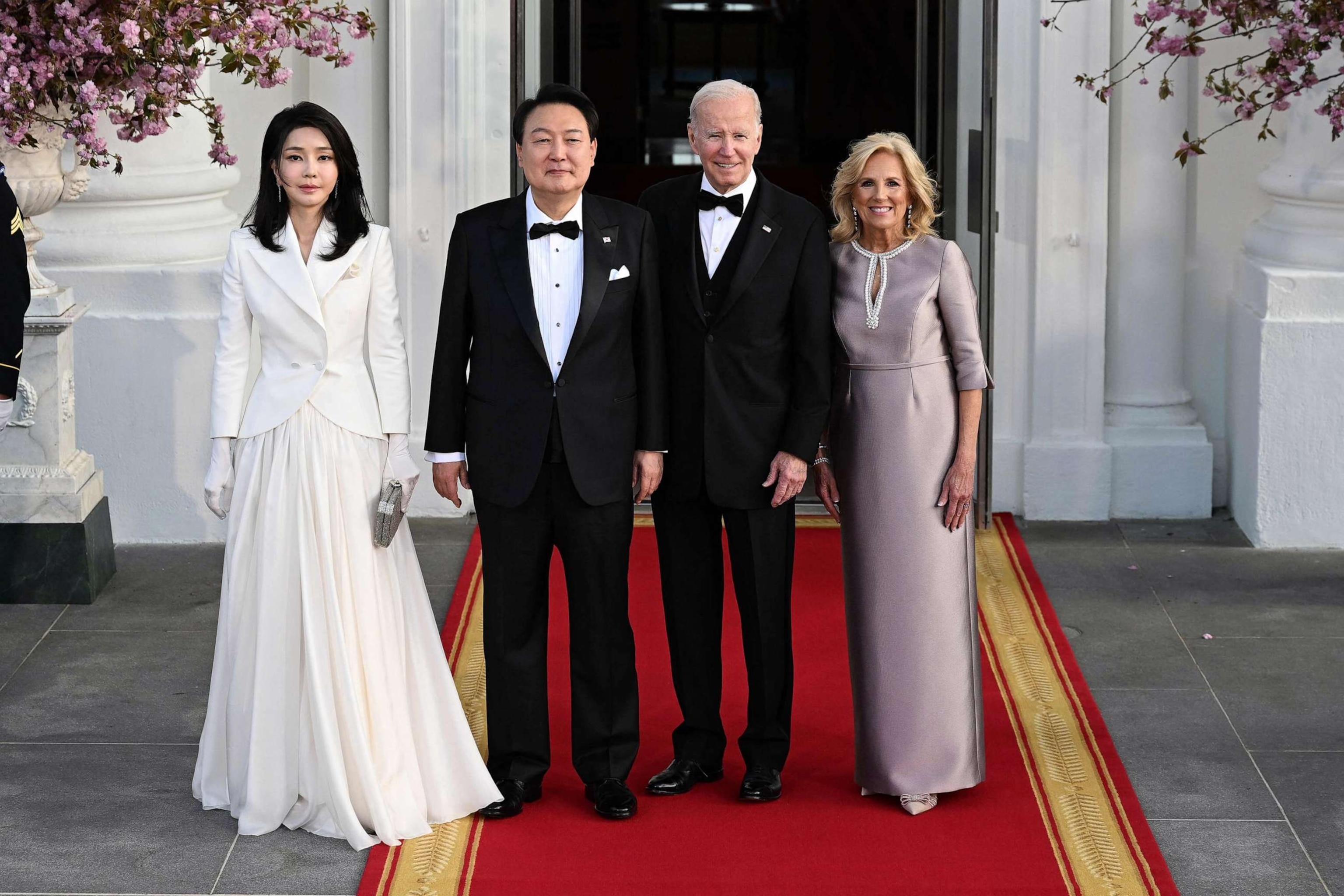 PHOTO: South Korean President Yoon Suk Yeol and his wife Kim Keon Hee stand with President Joe Biden first lady Jill Biden before a state dinner at the White House, April 26, 2023.