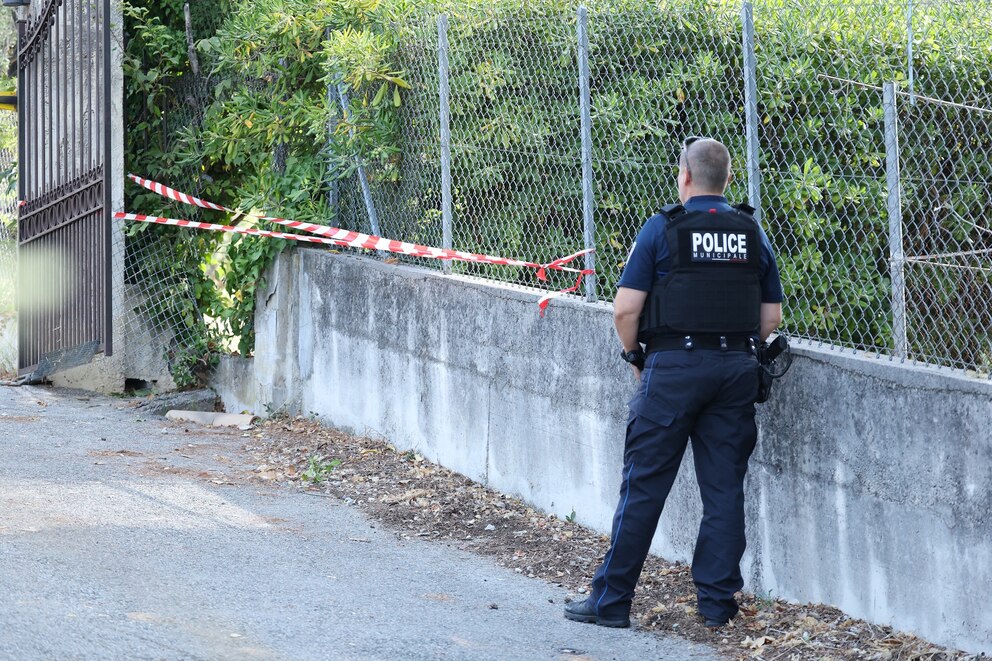 PHOTO: A police officer stands near a hole cut by the thieves in the outer fence of the Musee Renoir after four paintings in Cagnes-sur-Mer on Sept. 8, 2026.
