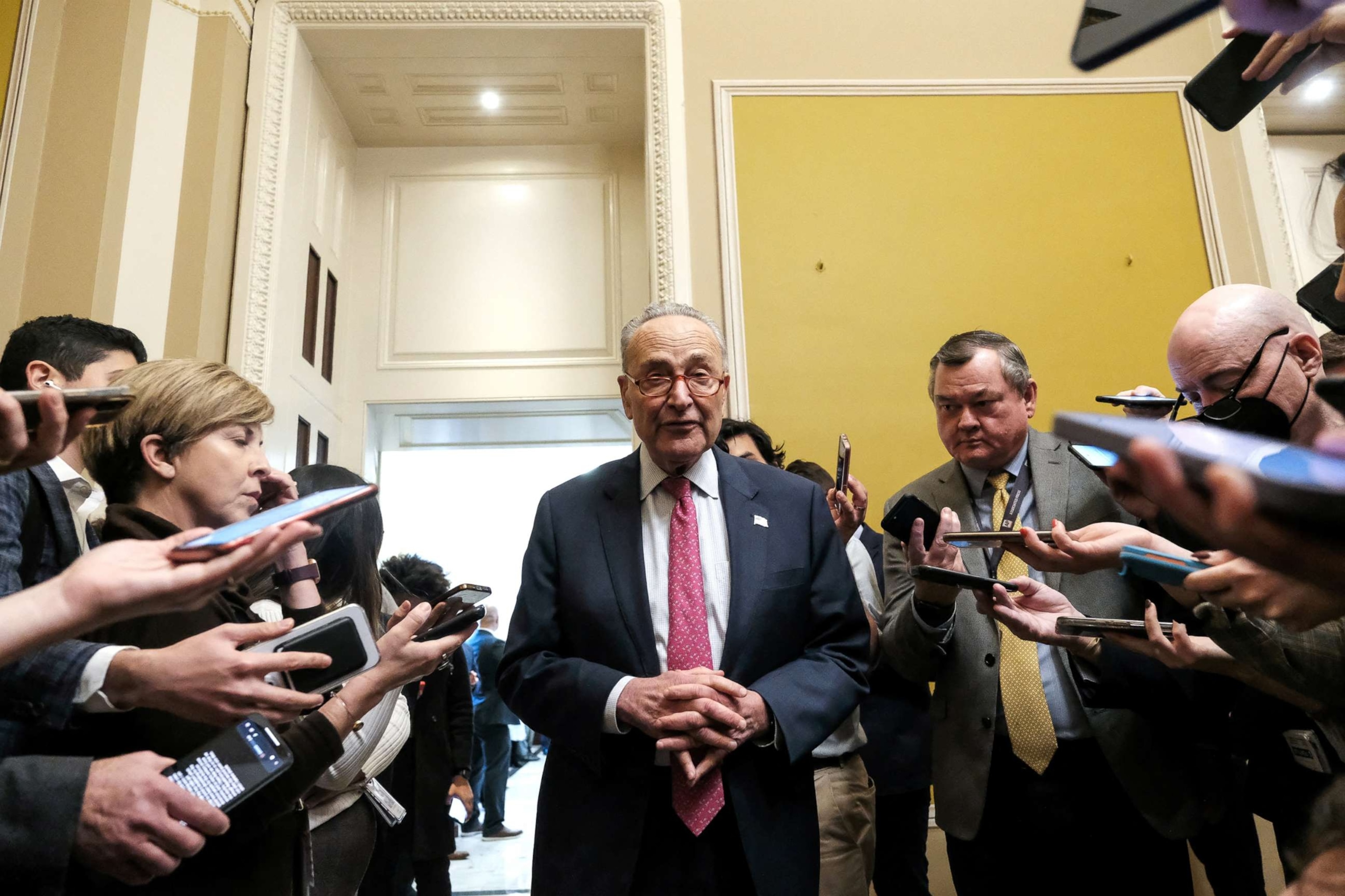 PHOTO: Senate Majority Leader Chuck Schumer speaks with members of the media prior to voting on a bill avoiding a nationwide railroad strike, on Capitol Hill, Dec. 1, 2022. 