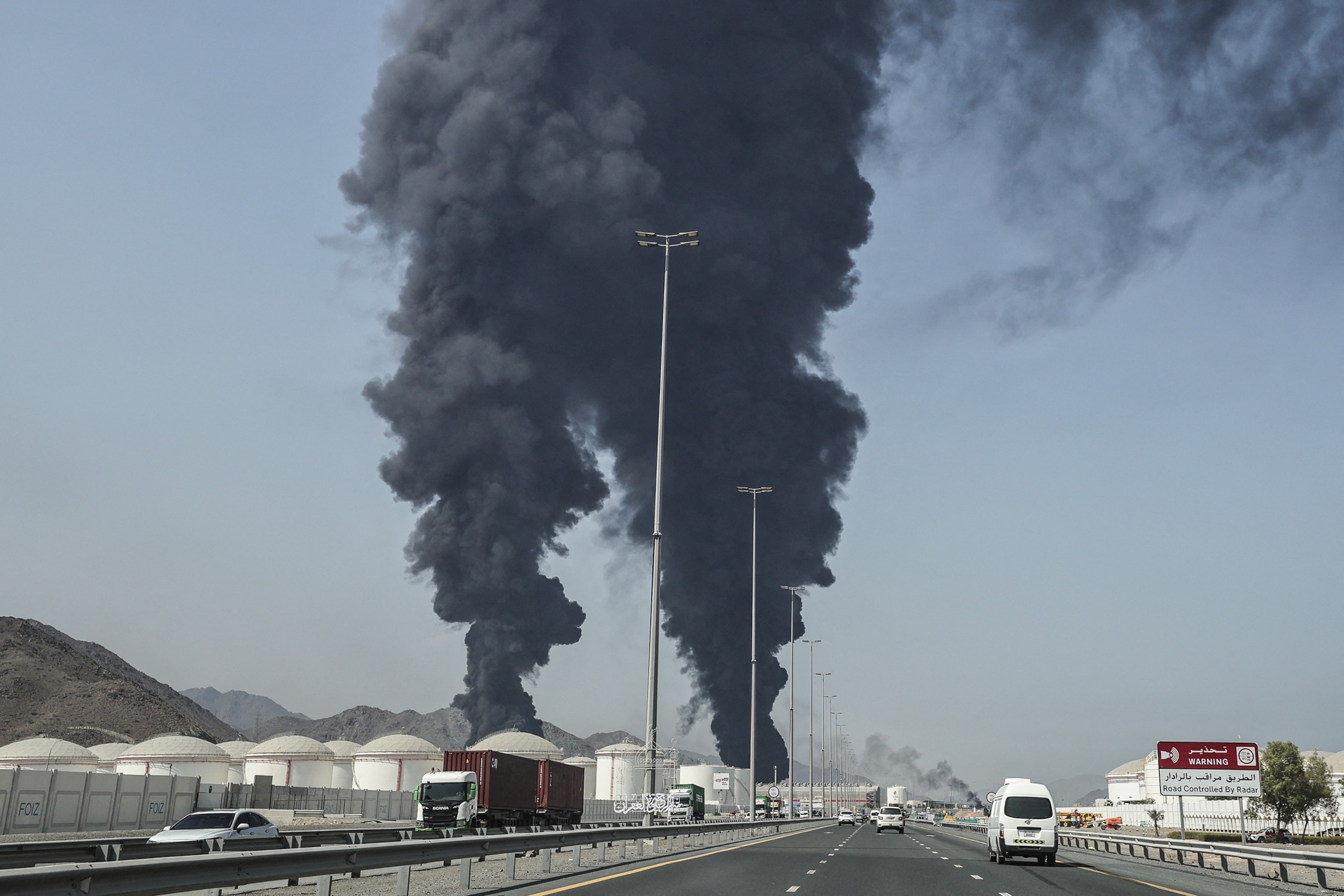 PHOTO: Smoke rises from the direction of an energy installation in the Gulf emirate of Fujairah on March 14, 2026. 