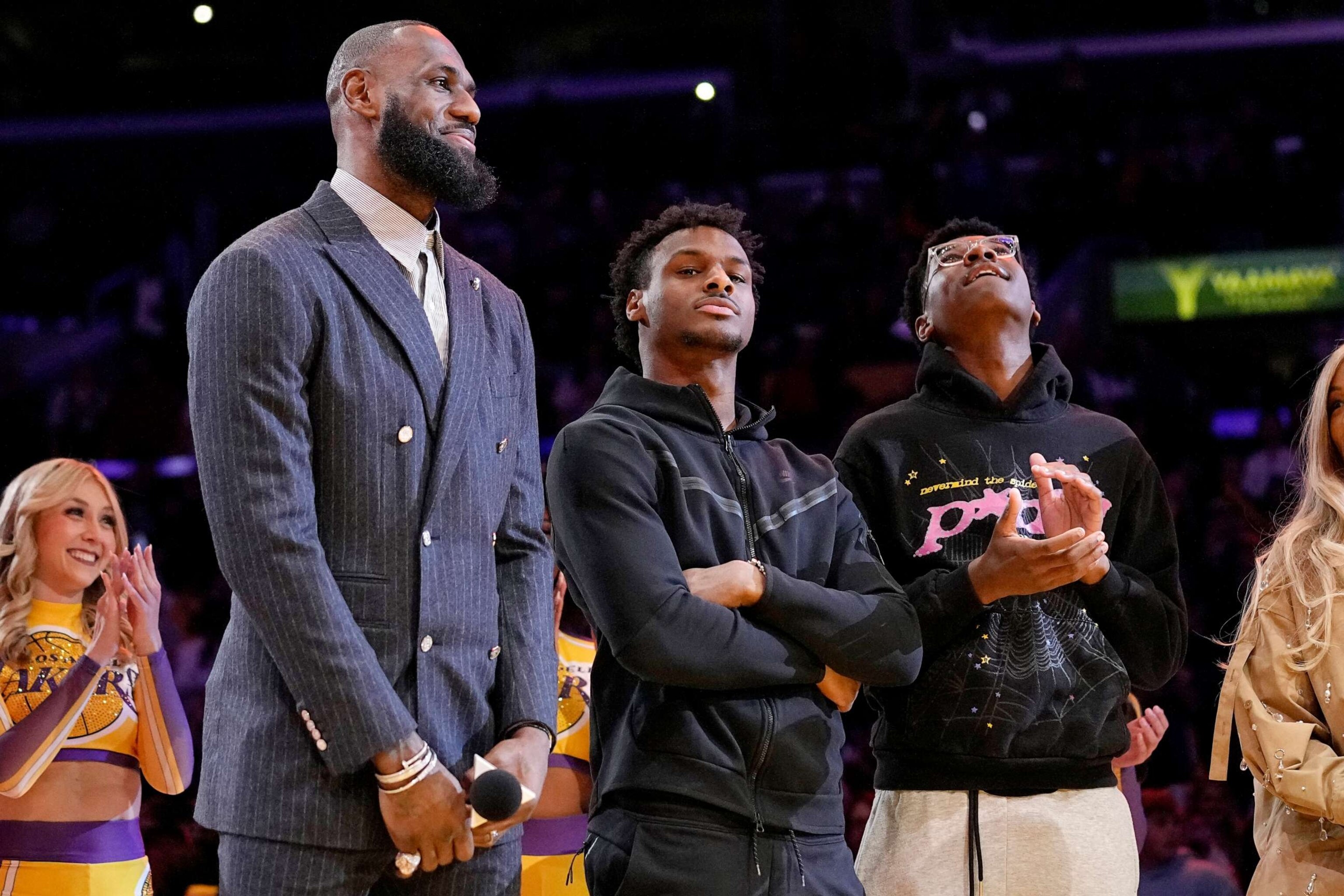 PHOTO: Los Angeles Lakers forward LeBron James, second from left, Bronny James, center, and Bryce James stand during a ceremony honoring LeBron James, Feb. 9, 2023, in Los Angeles.