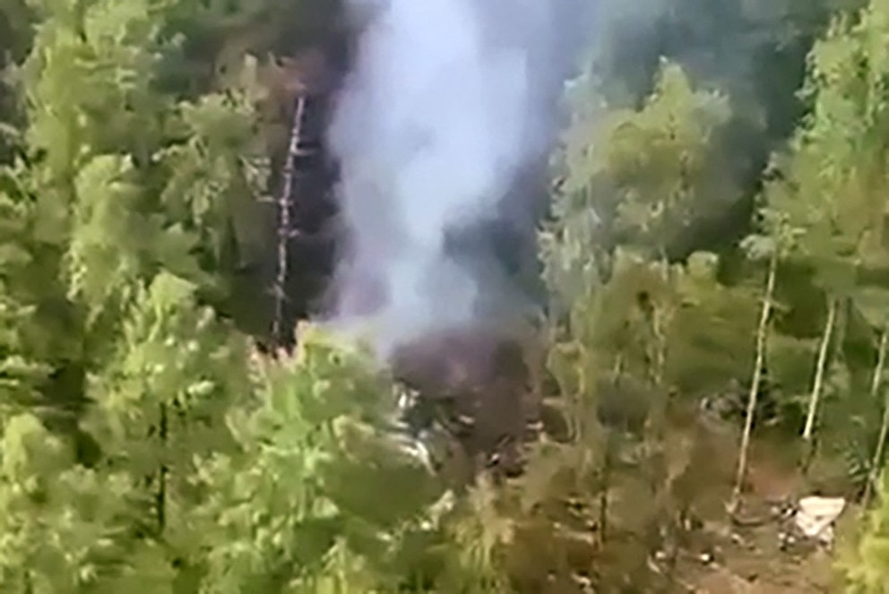 PHOTO: This grab from a handout footage released by the Eastern Interregional Directorate for Transport of the Russian Investigative Committee on July 24, 2025, shows the crash site of the Antonov An-24 passenger plane outside the town of Tynda, Russia.