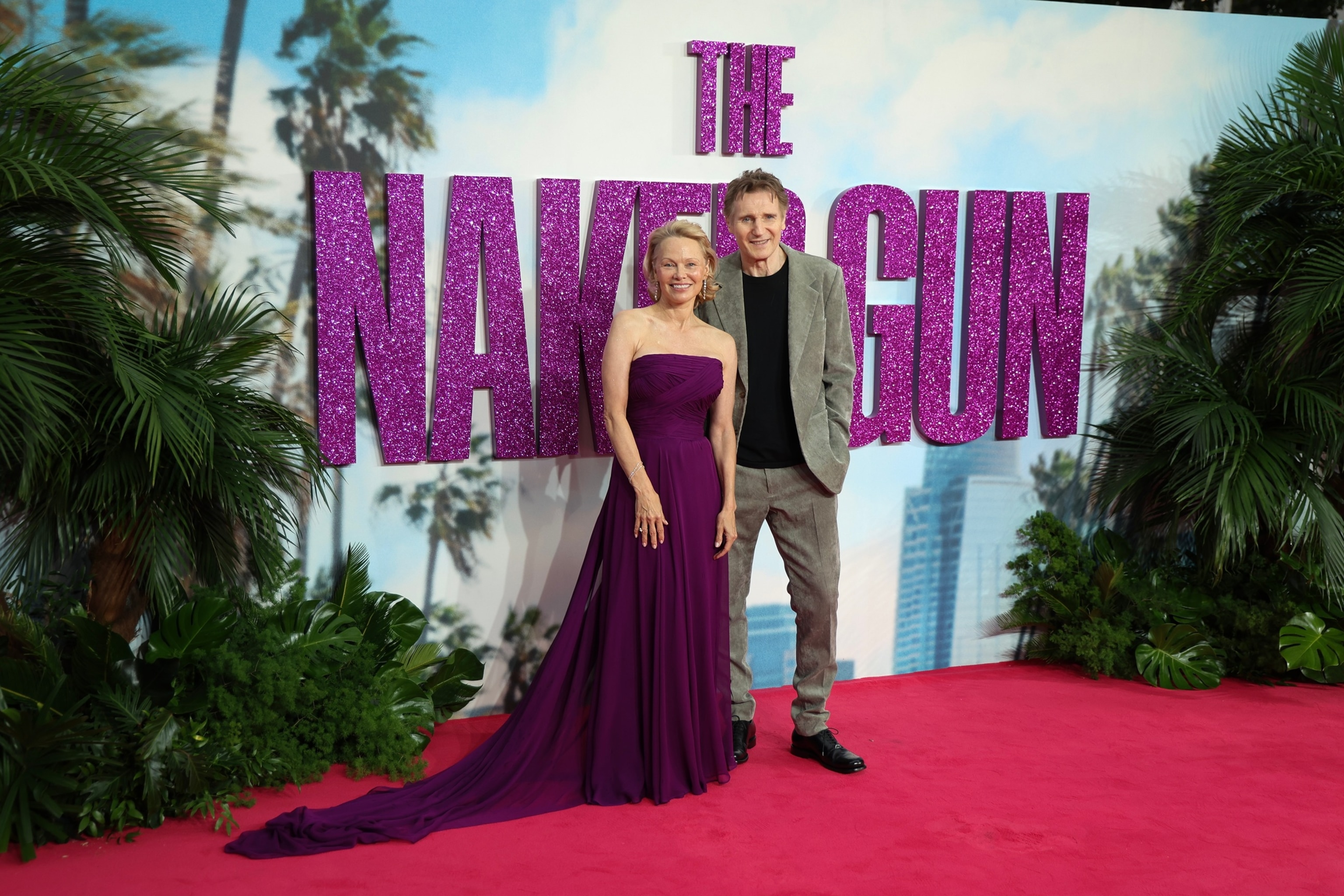 Pamela Anderson, Liam Neeson share sweet moment at 'The Naked Gun