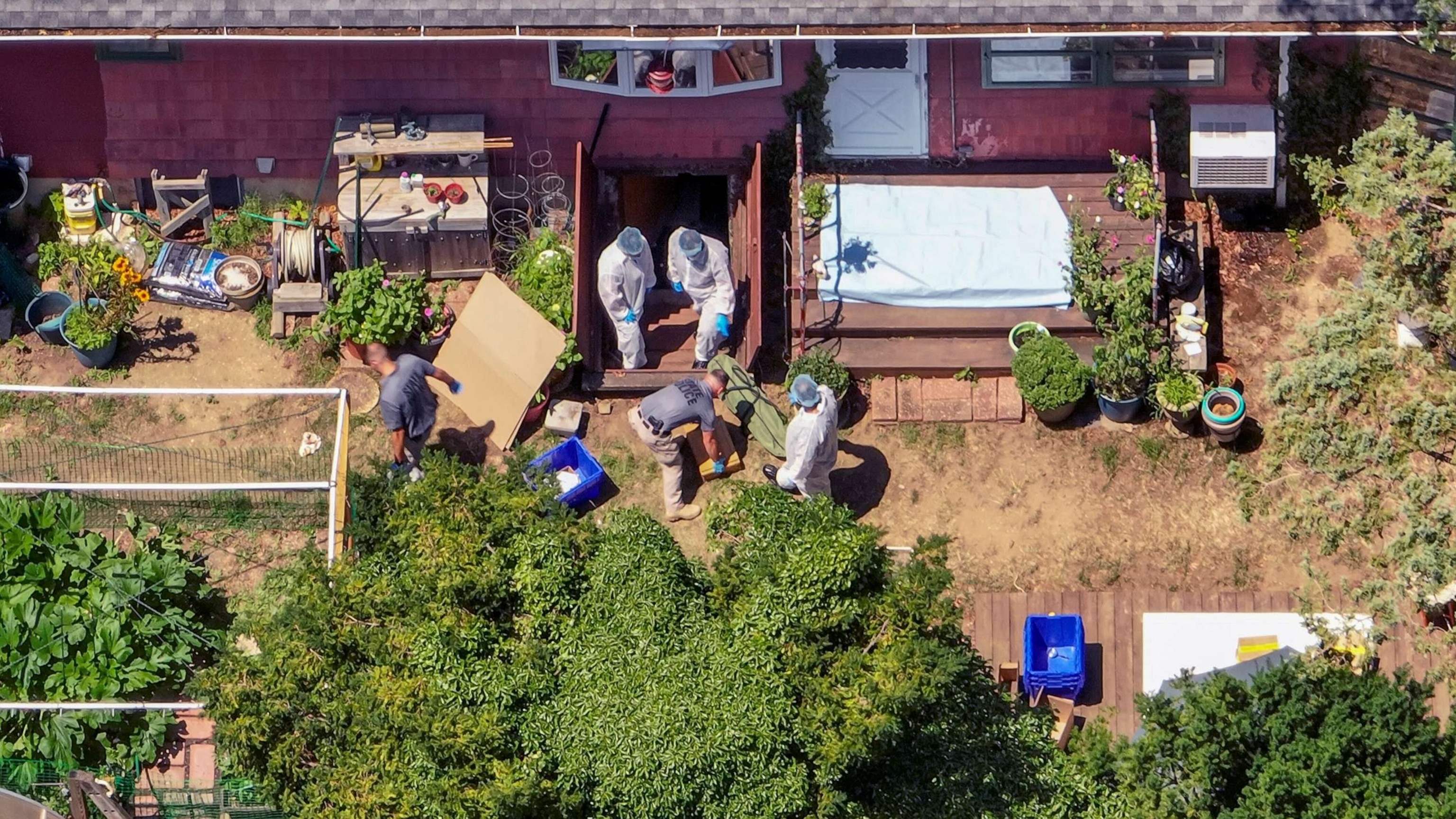 PHOTO: Investigators comb through the home of Rex Heuermann in Massapequa Park, N.Y. after he was arrested as she suspect in the Gilgo Beach killings, on July 15, 2023.