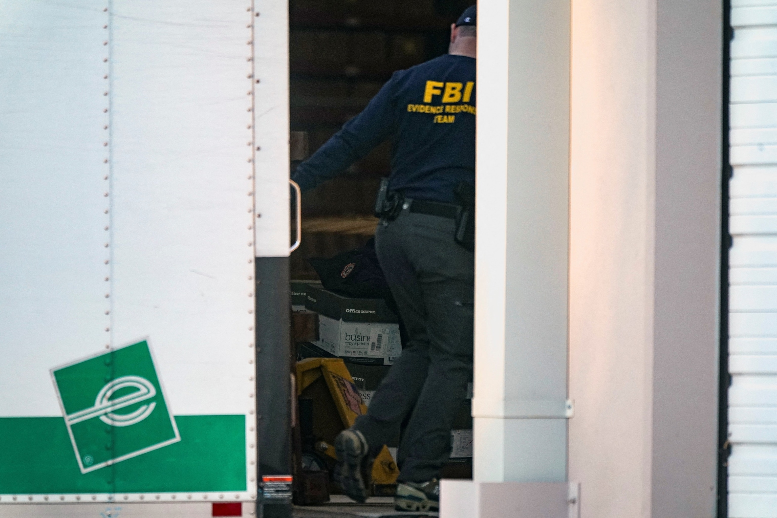 PHOTO: A member of the FBI Evidence Response Team works outside the Fulton County Election Hub and Operation Center after the FBI executed a search warrant there in relation to the 2020 election in Union City, Georgia, January 28, 2026.