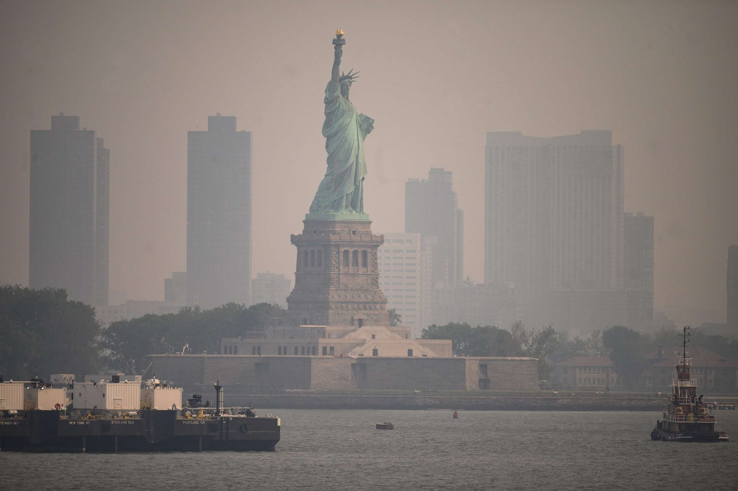 PHOTO: The Statue of Liberty from the Staten Island Ferry during heavy smog in New York, June 6, 2023.