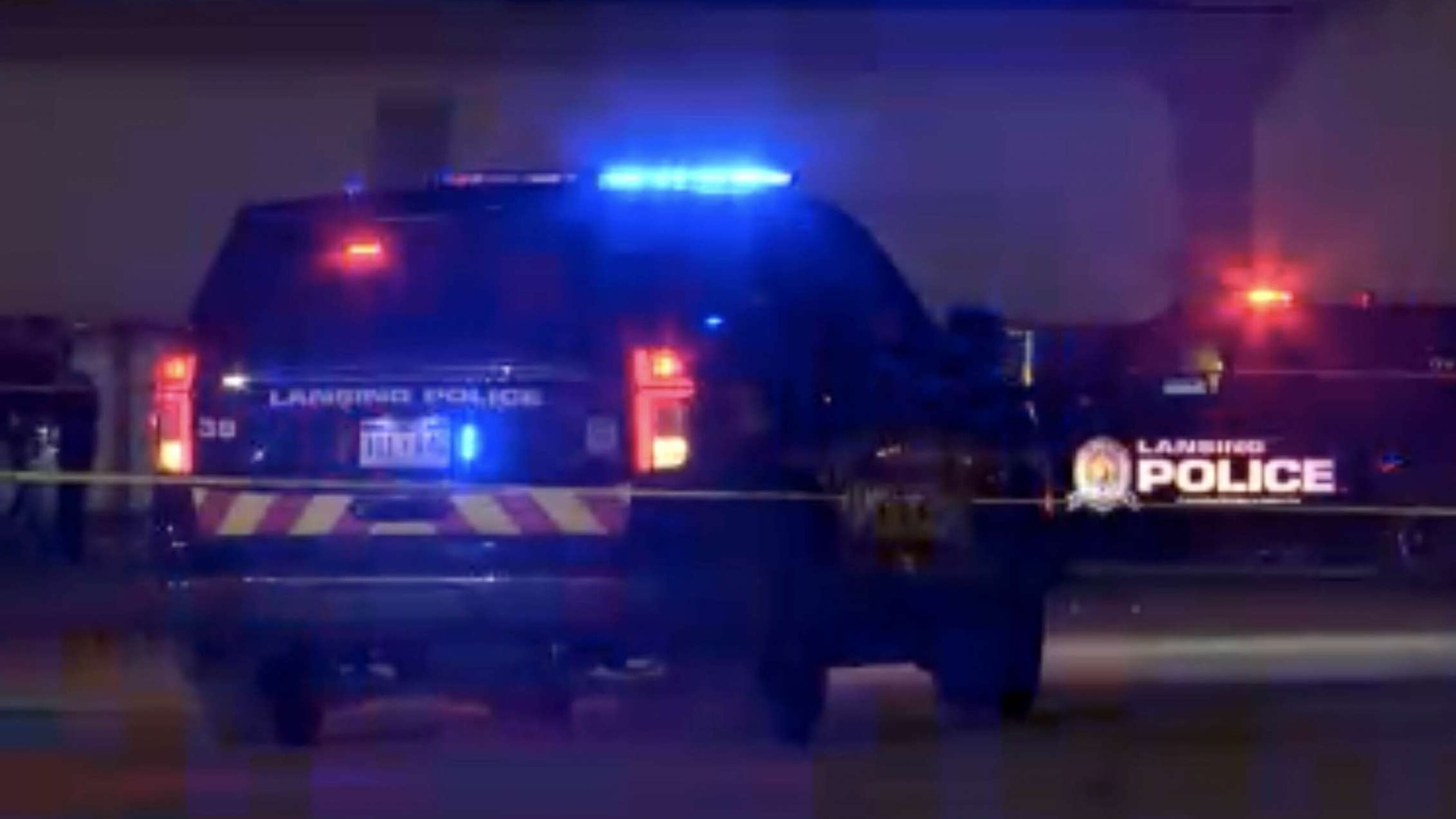 PHOTO: Police officers cordon off a crime scene at the Logan Square Mall in Lansing on July 30, 2023, after a shooting left five people injured, two in critical condition.