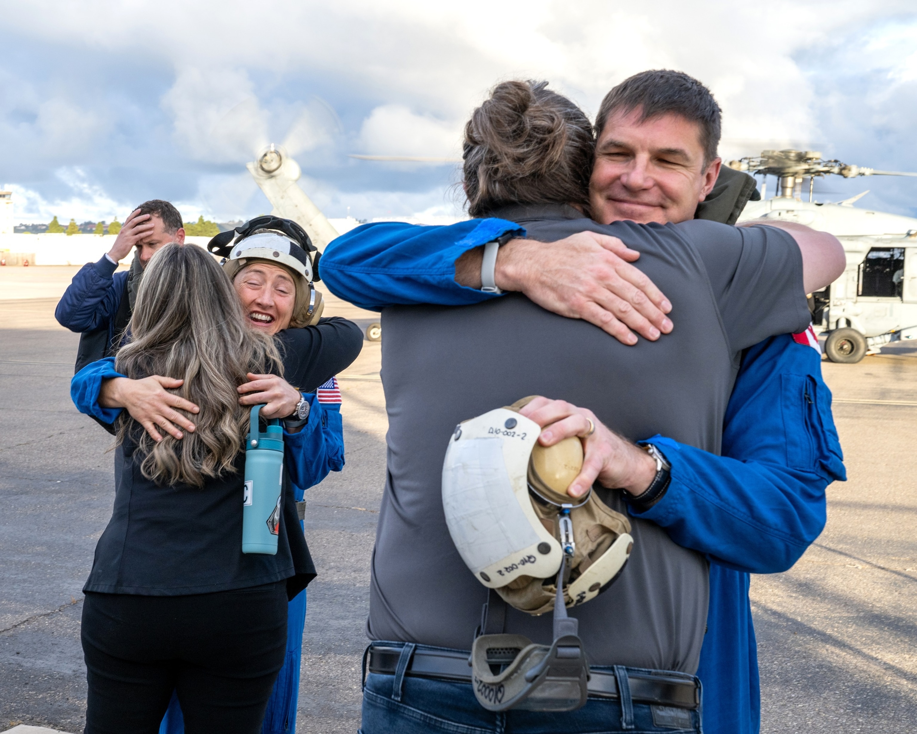 PHOTO: Artemis II NASA astronaut Christina Koch, mission specialist, and CSA (Canadian Space Agency) astronaut Jeremy Hansen, greet NASA team members on April 11, 2026.