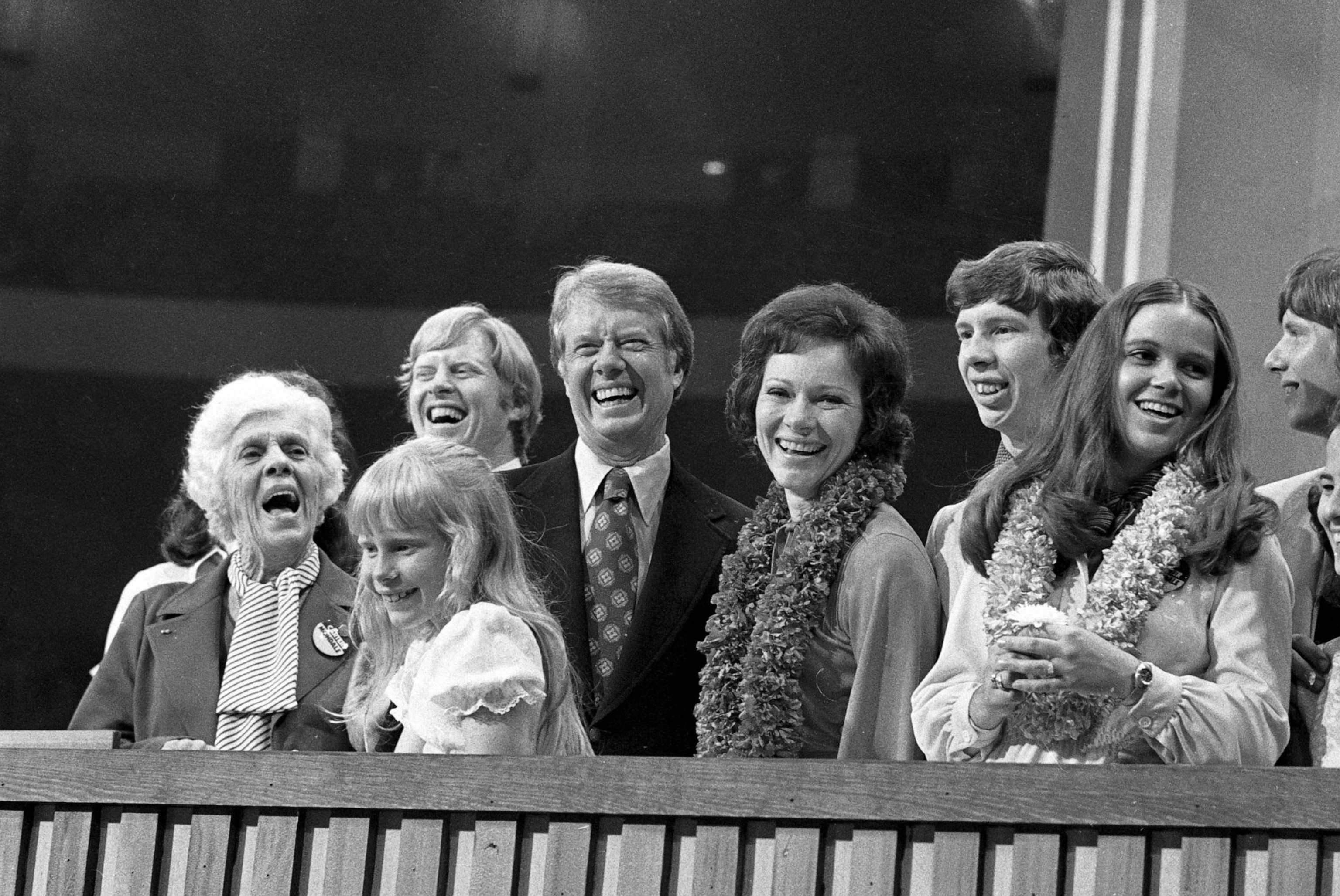 PHOTO: Democratic Presidential nominee, Jimmy Carter, and his wife, Rosalynn, are surrounded by family on the podium after Carter made his acceptance speech.