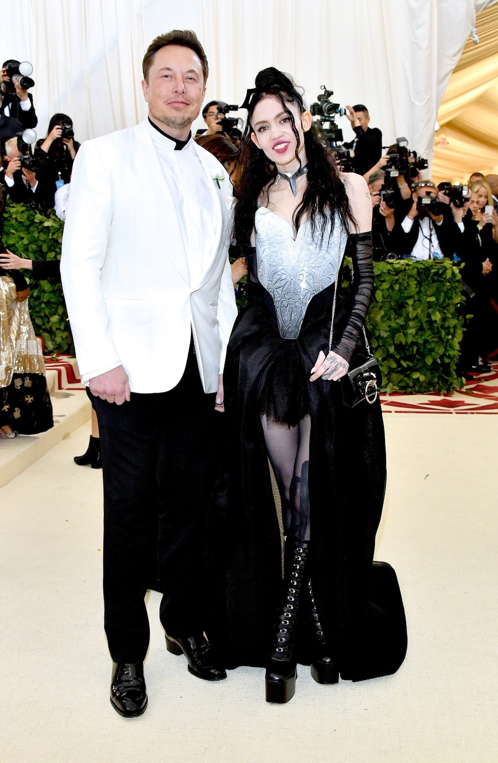 PHOTO: In this May 7, 2018  file photo Elon Musk and Grimes attend the Heavenly Bodies: Fashion & The Catholic Imagination Costume Institute Gala at The Metropolitan Museum of Art in New York City.