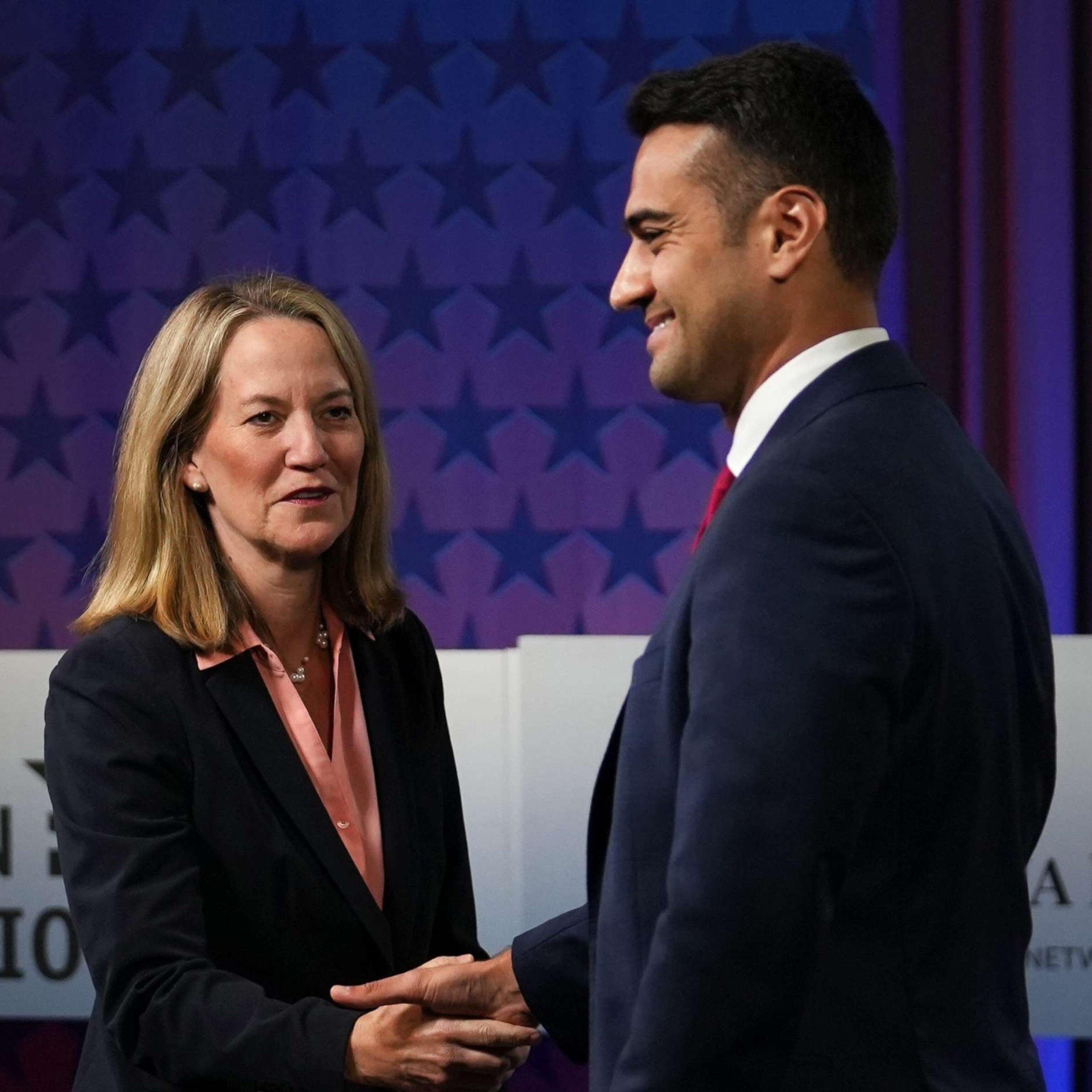 PHOTO: Attorney General candidates Republican Abe Hamadeh and Democrat Kris Mayes meet for a debate at the Arizona PBS studio, Sept. 28, 2022.