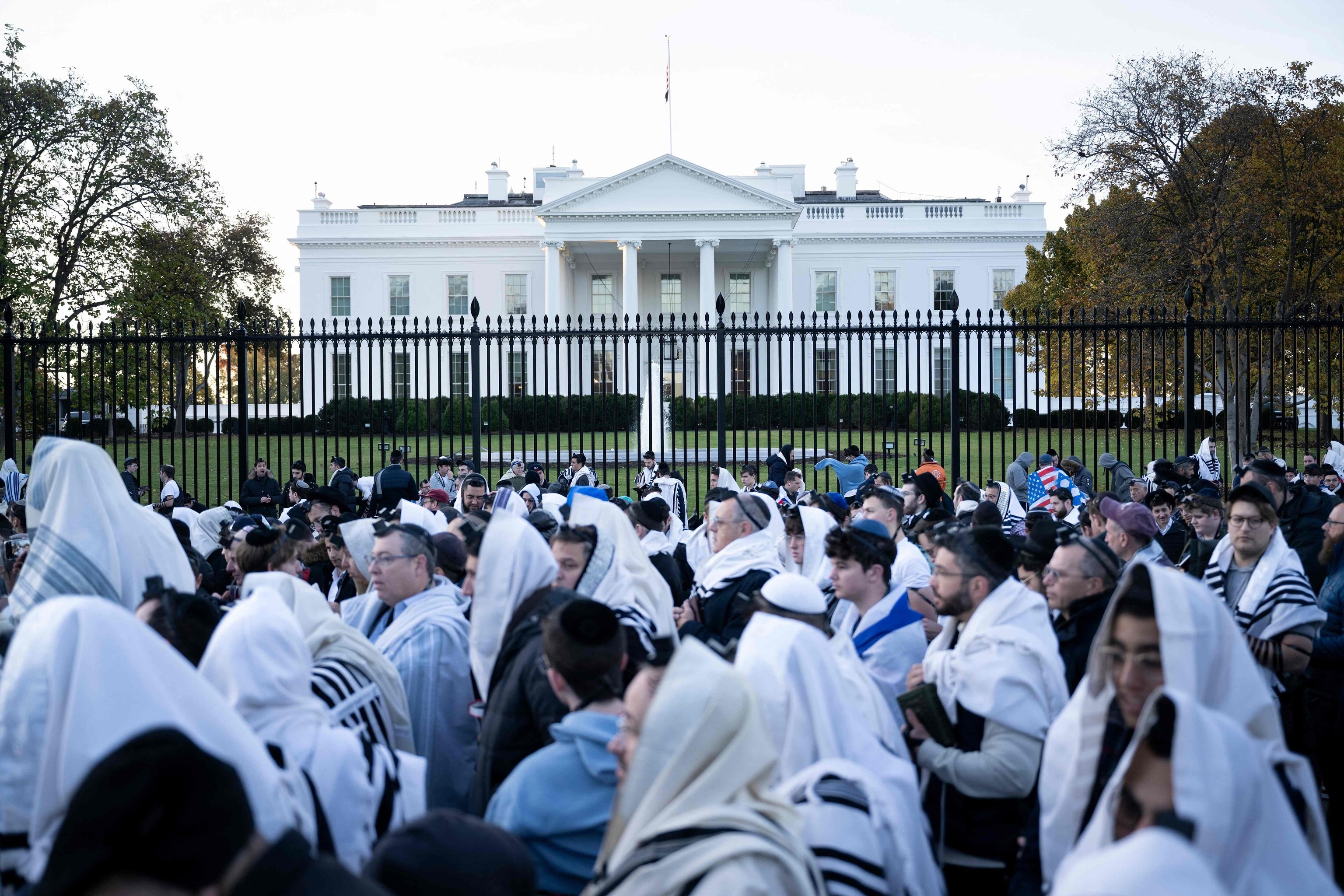 PHOTO: People pray on Pennsylvania Avenue in front of the White House before a rally supporting Israel during its conflict with Hamas Nov. 14, 2023, in Washington, DC. 