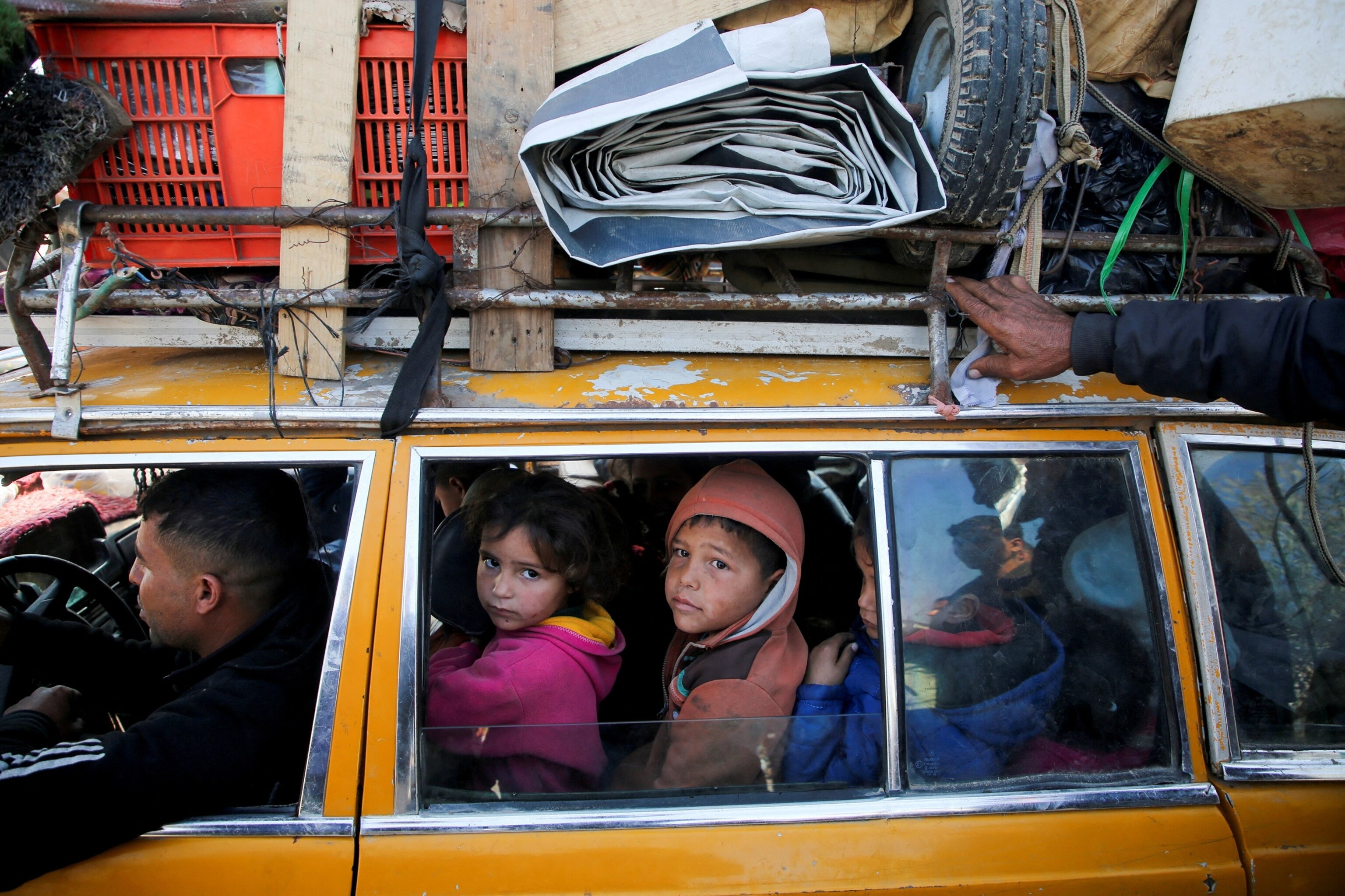 PHOTO: Palestinians, who were displaced to the south at Israel's order during the war, wait to head back to their homes in northern Gaza by vehicle through Salahudeen Road in the central Gaza Strip, Jan. 27, 2025.