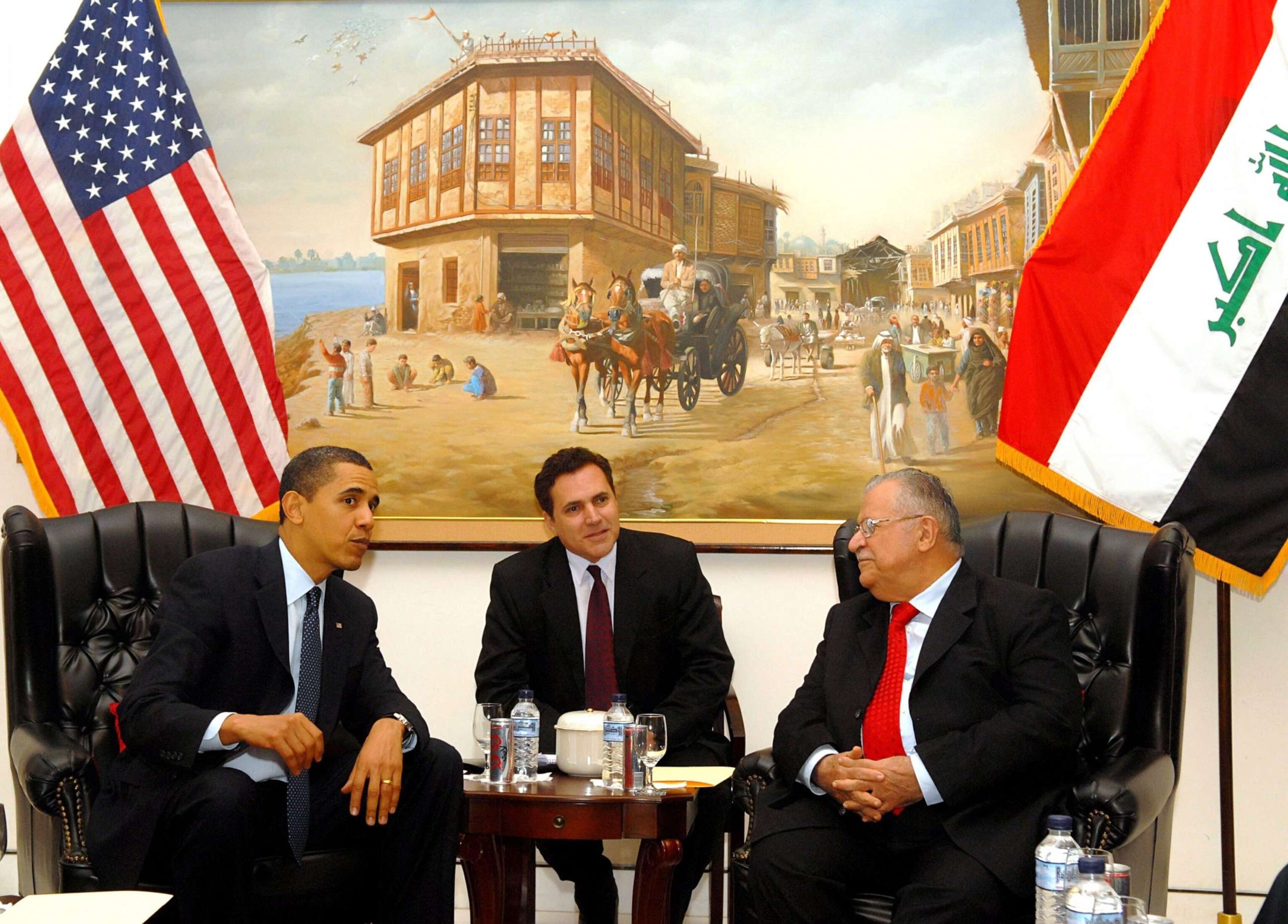 PHOTO: Iraqi President Jalal Talabani (R) speaks with U.S. President Barack Obama (L) as an interpreter sits (C) April 7, 2009 in Baghdad.